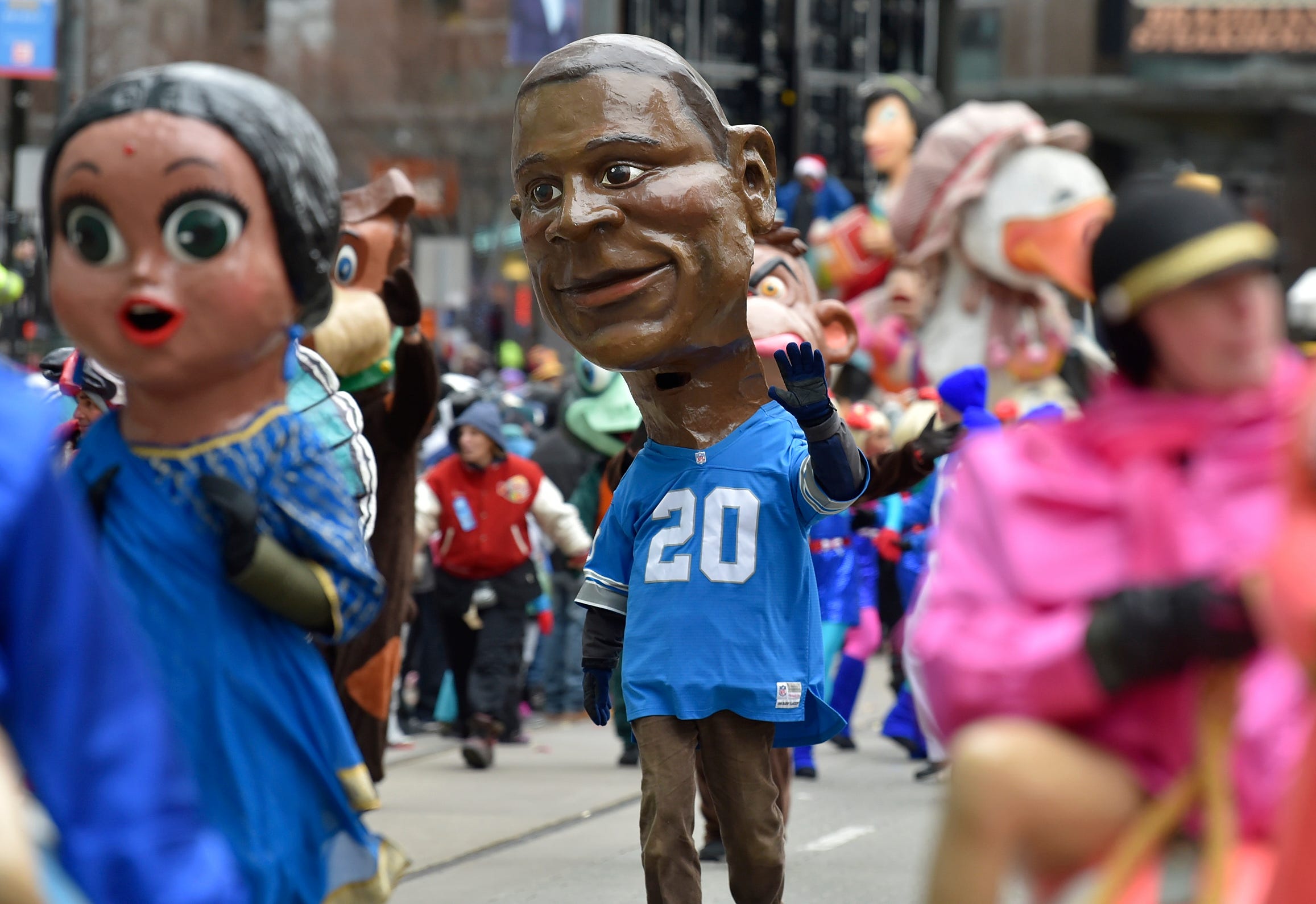 Barry Sanders is one of 80 paper mache heads from the Big Head Corps.