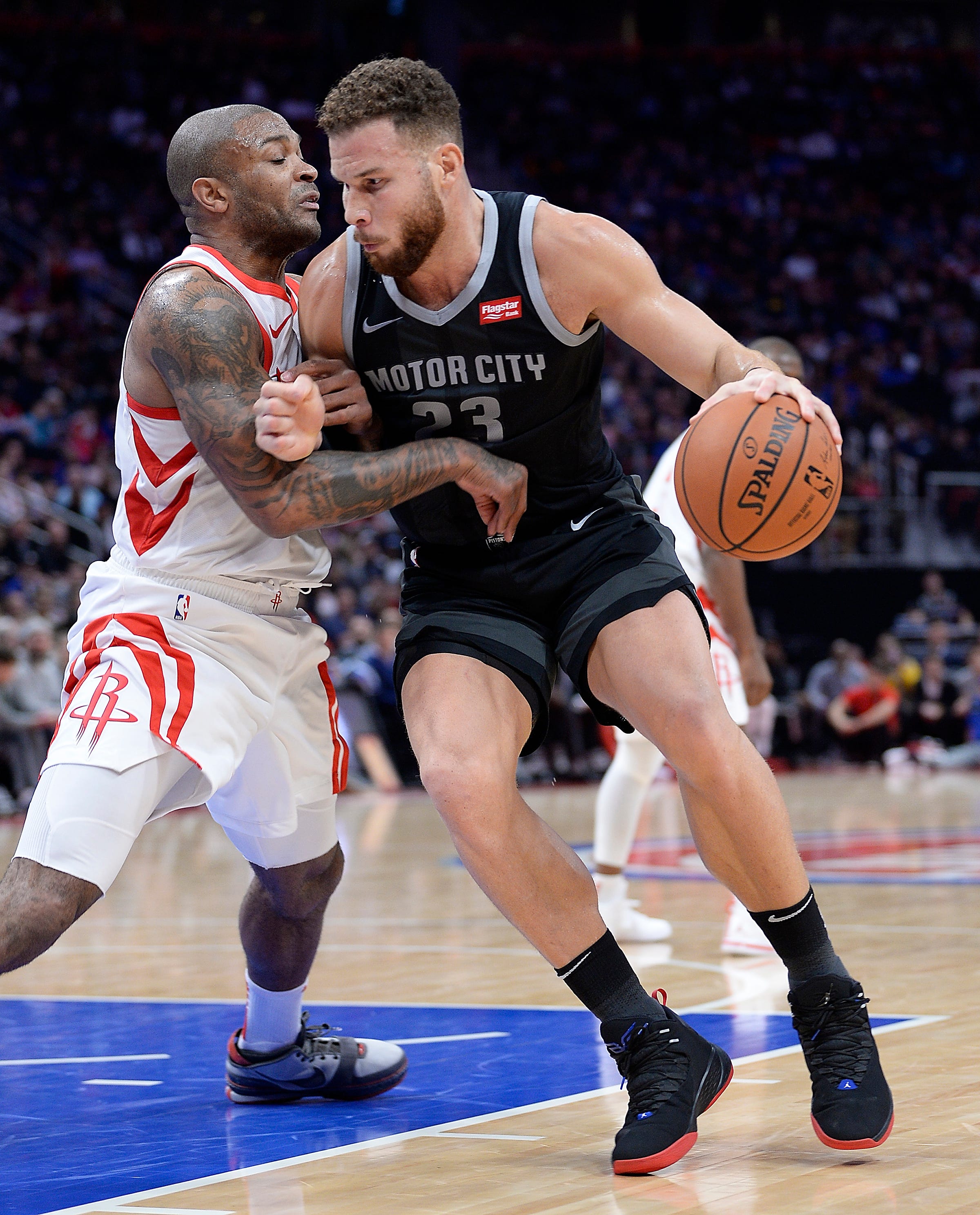 Pistons' Blake Griffin drives around Rockets' P.J. Tucker in the second quarter.