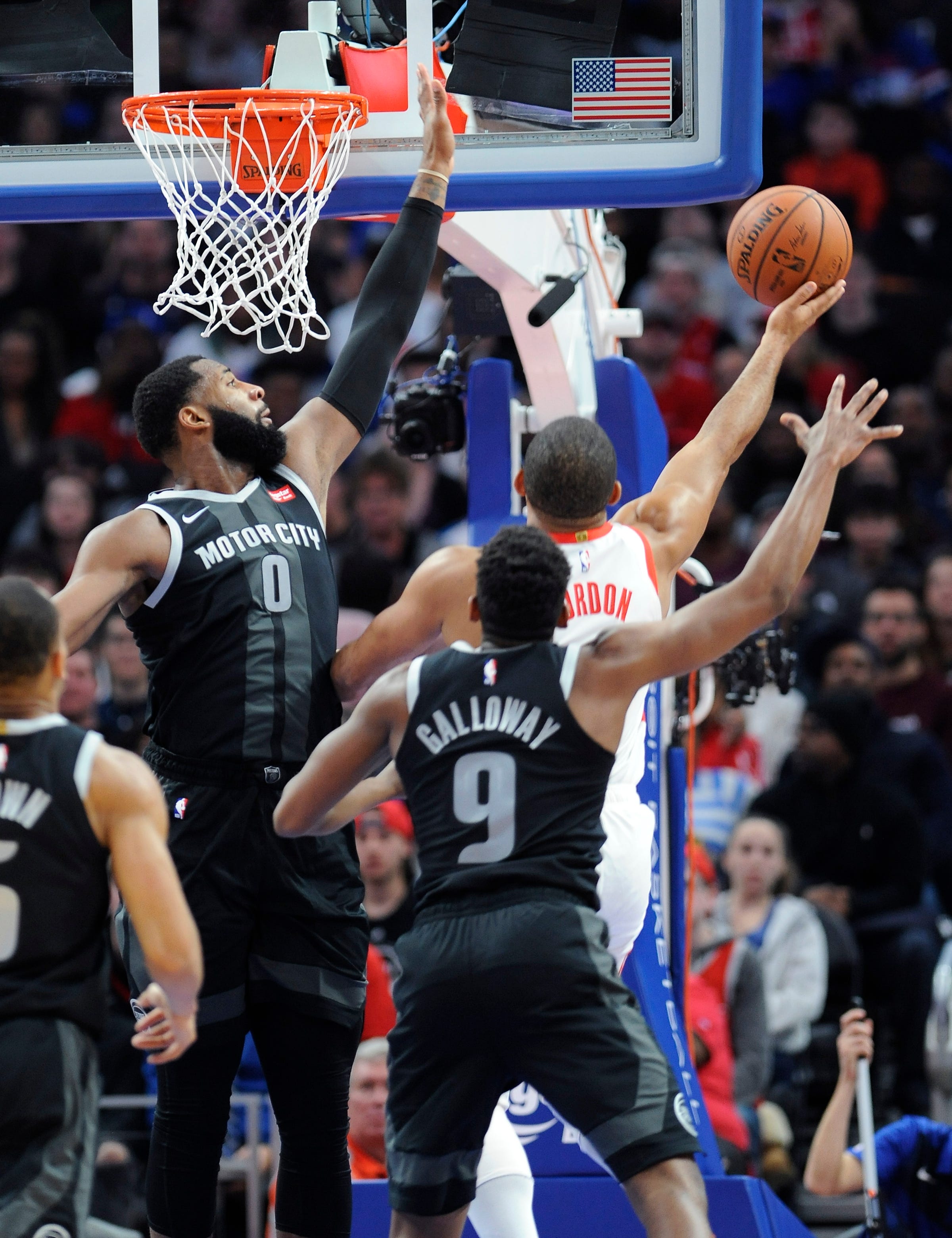 Pistons' Andre Drummond blocks the shot of Rockets' Eric Gordon in the second quarter.