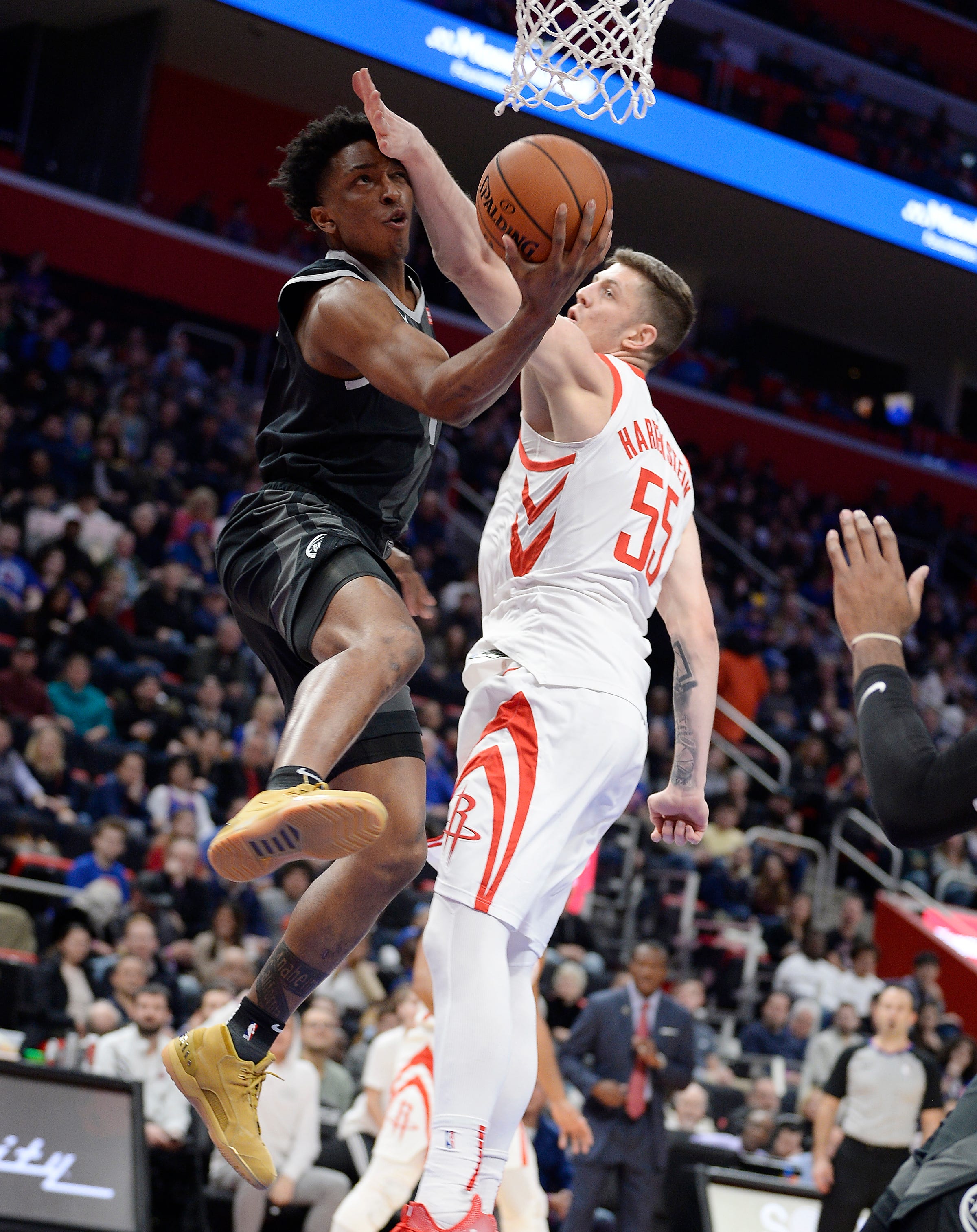 Pistons' Stanley Johnson shoots over Rockets' Isaiah Hartenstein in the second quarter.s