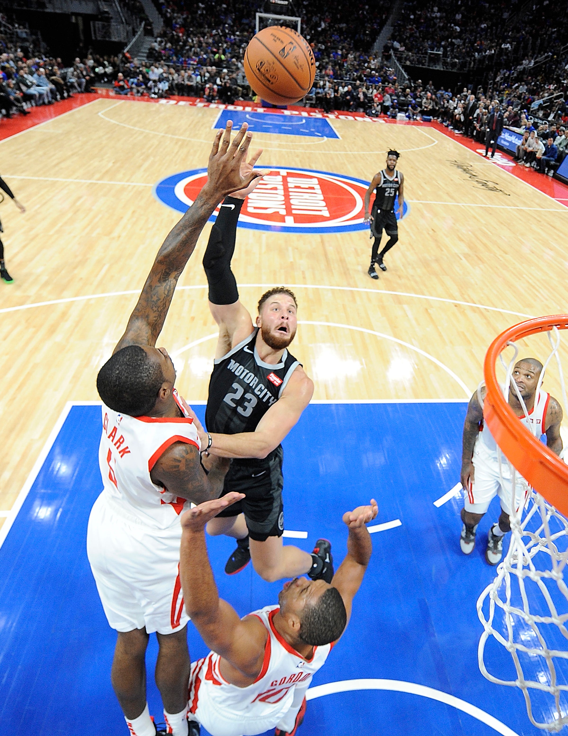 Pistons' Blake Griffin shoots over Rockets' Gary Clark in the third quarter.