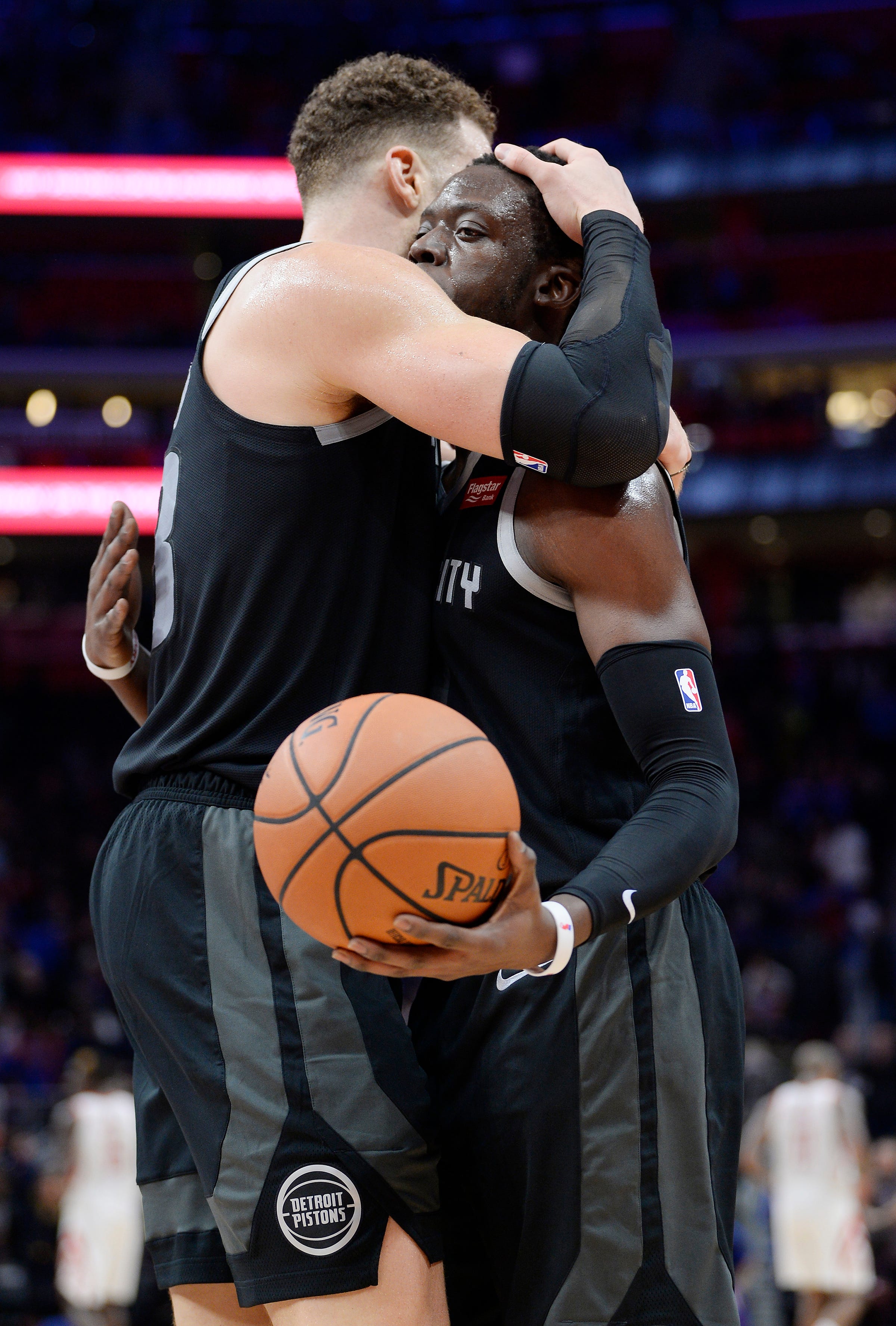 From left, Pistons' Blake Griffin congratulates Reggie Jackson at the end of the game after the Pistons win 116-111 in overtime over Houston Rockets, Little Caesars Arena, November, 23, 2018, Detroit, Mi.
