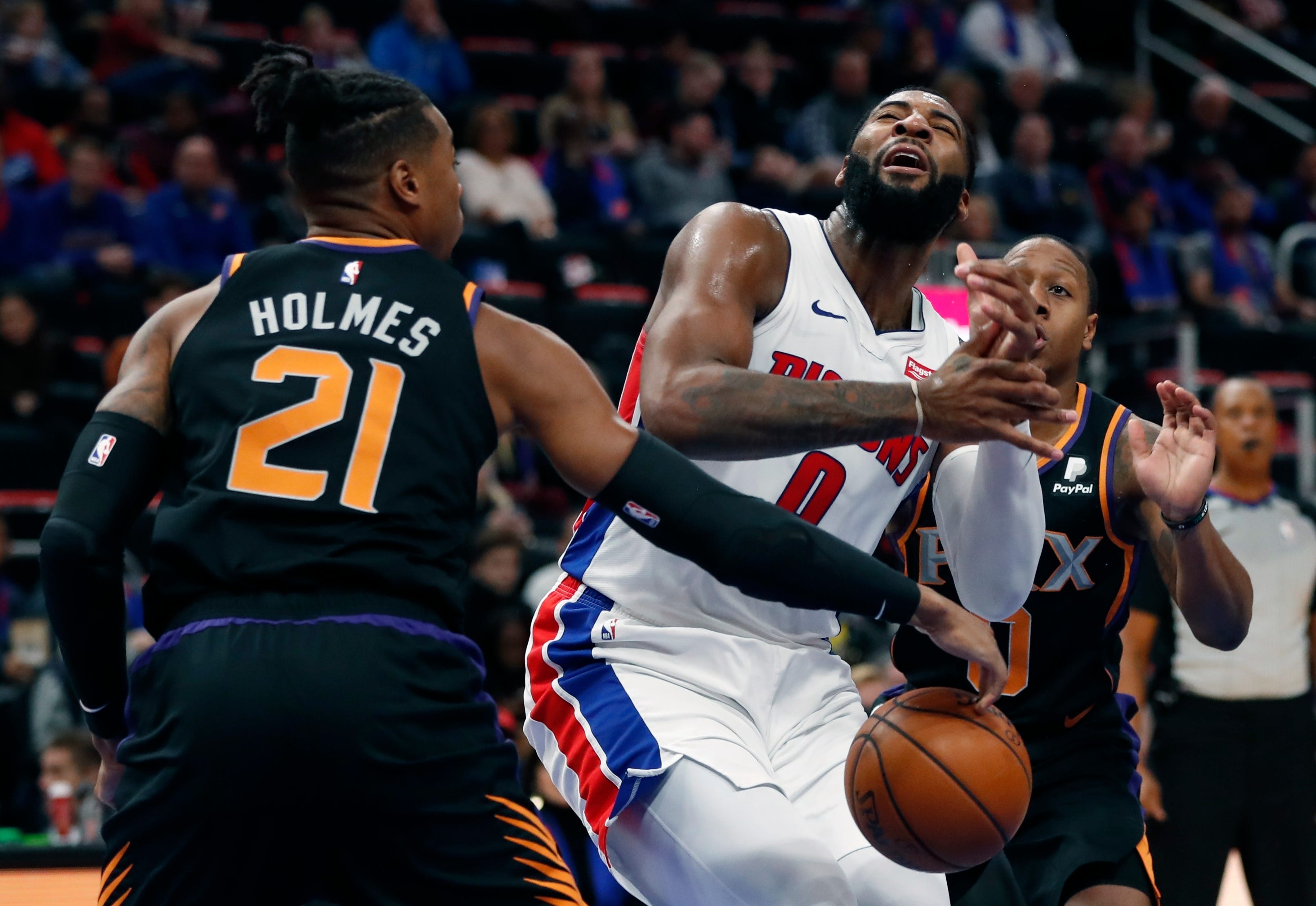 Phoenix Suns forward Richaun Holmes defends against Detroit Pistons center Andre Drummond on Sunday.