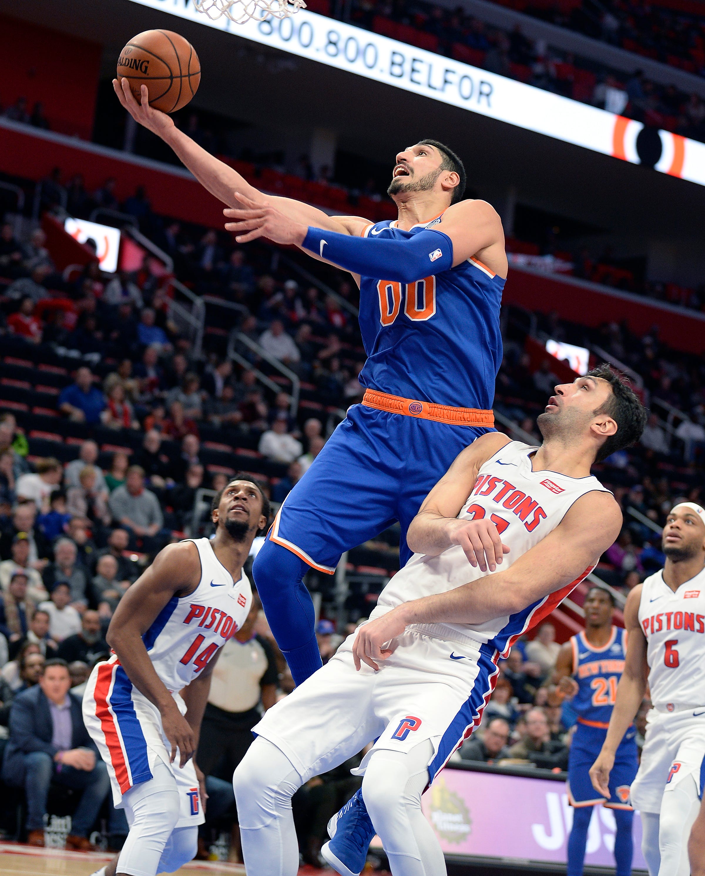 Knicks ' Enes Kanter scores over Pistons ' Zaza Pachulia in the fourth quarter.