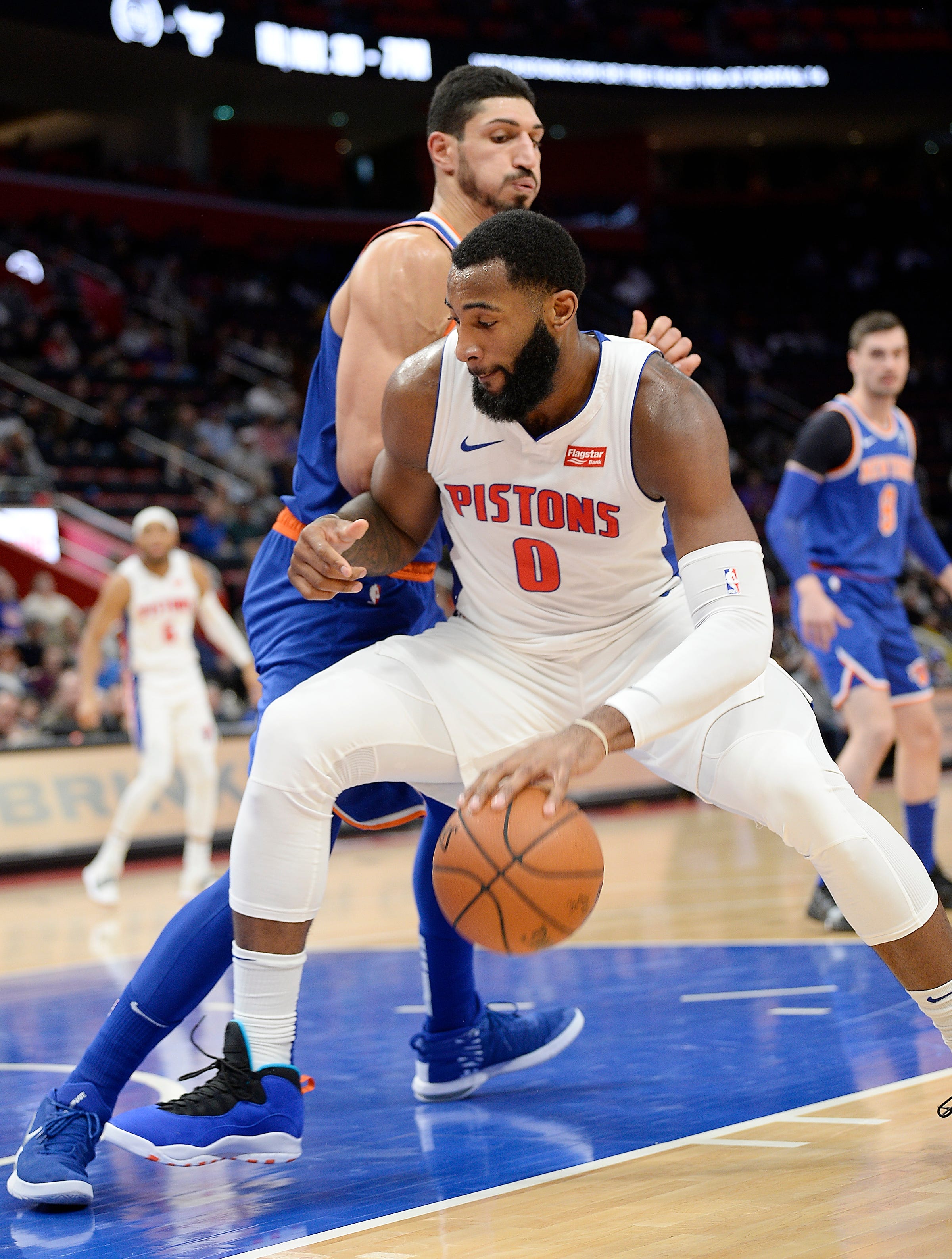 Pistons' Andre Drummond drives around Knicks' Enes Kanter in the second quarter.