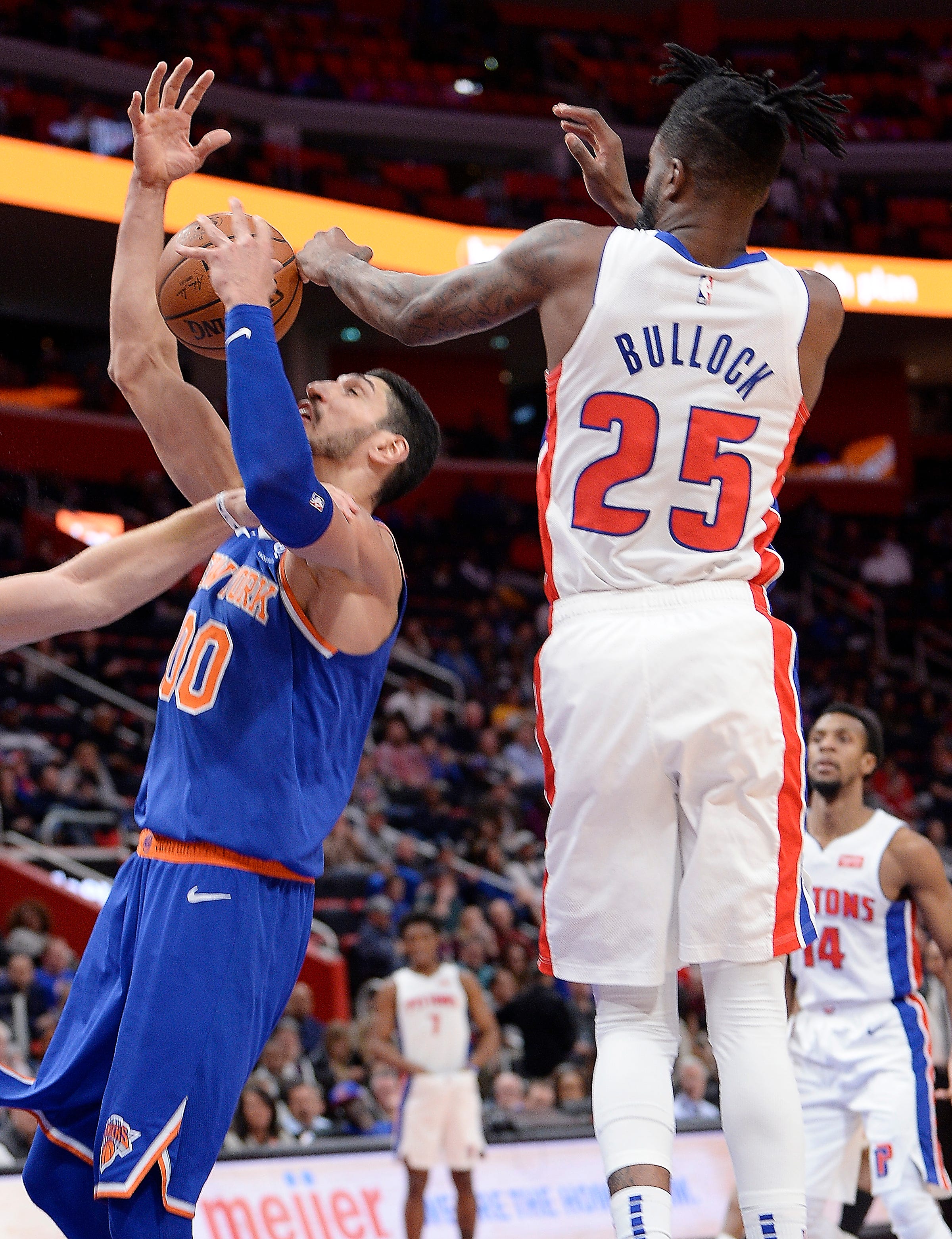 Pistons' Reggie Bullock blocks the shot of Knicks' Enes Kanter in the third quarter.