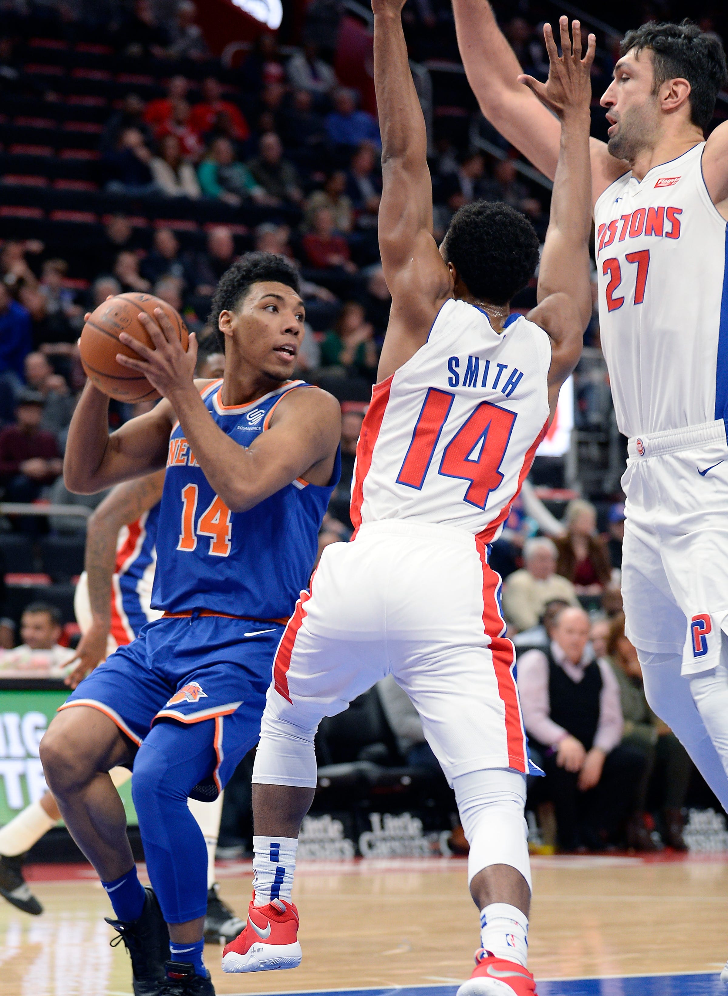 Knicks' Allonzo Trier looks for room around Pistons' Ish Smith in the fourth quarter.
