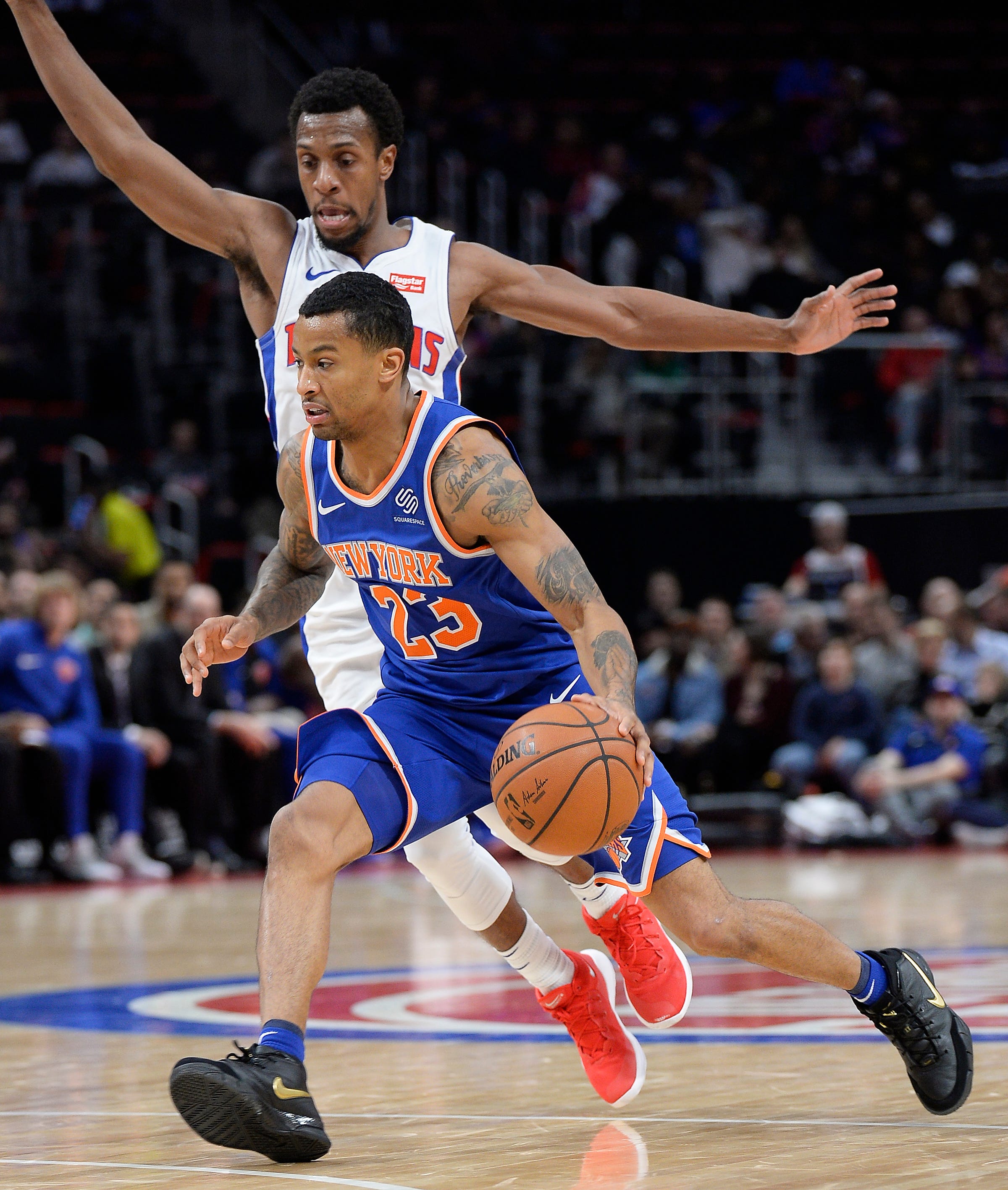 Knicks' Trey Burke drives around Pistons' Ish Smith in the third quarter.