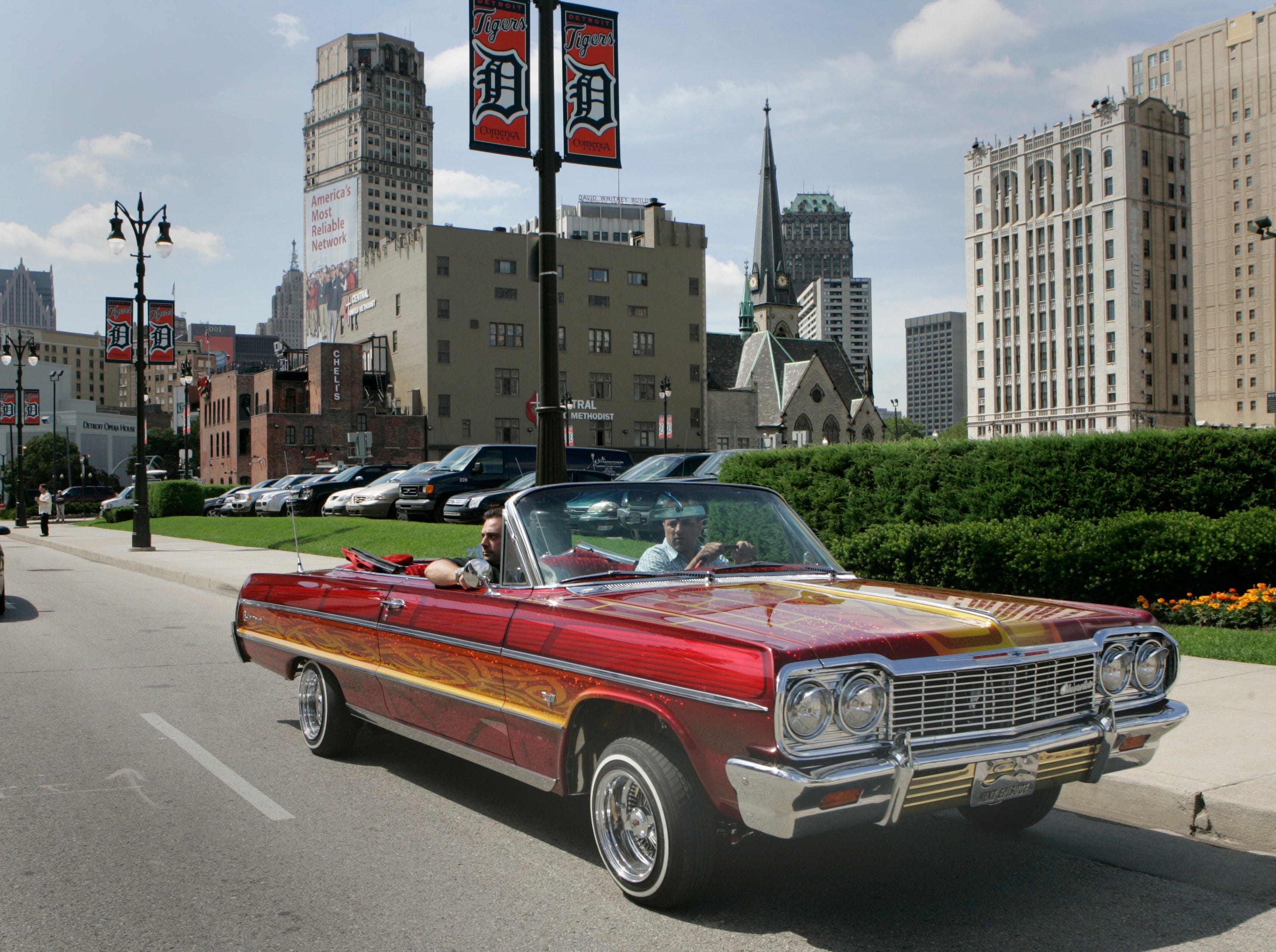 A 1964 Chevy Impala owned by Thomas Cavataio drives down Woodward in Detroit, June 24, 2008.