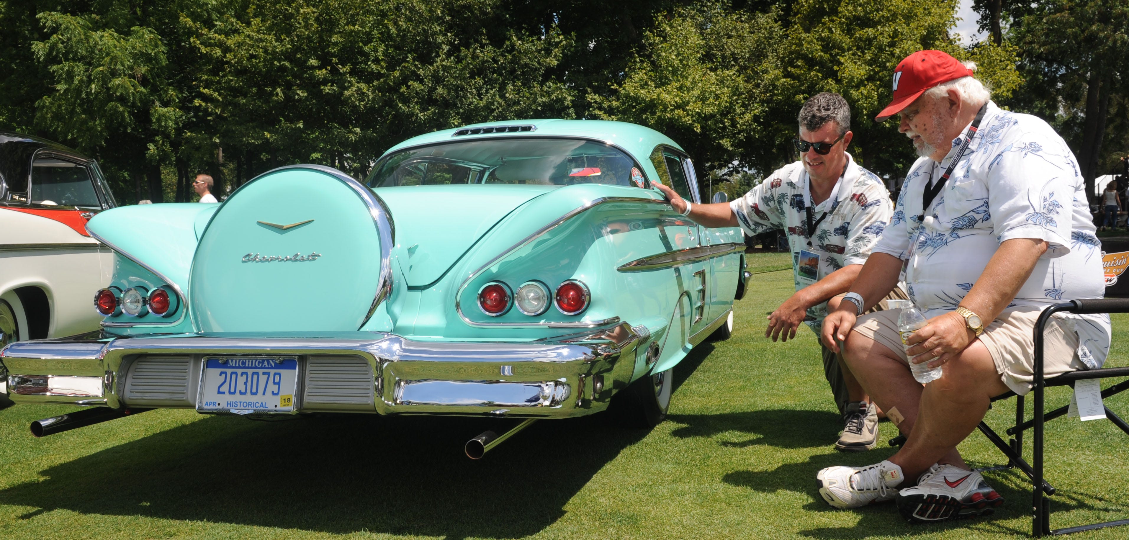 Kurt Machacek and his father Bob Machacek, of Farmington Hills, with their 1958 Chevrolet Impala during the Concours d'Elegance at St. John's in Plymouth.