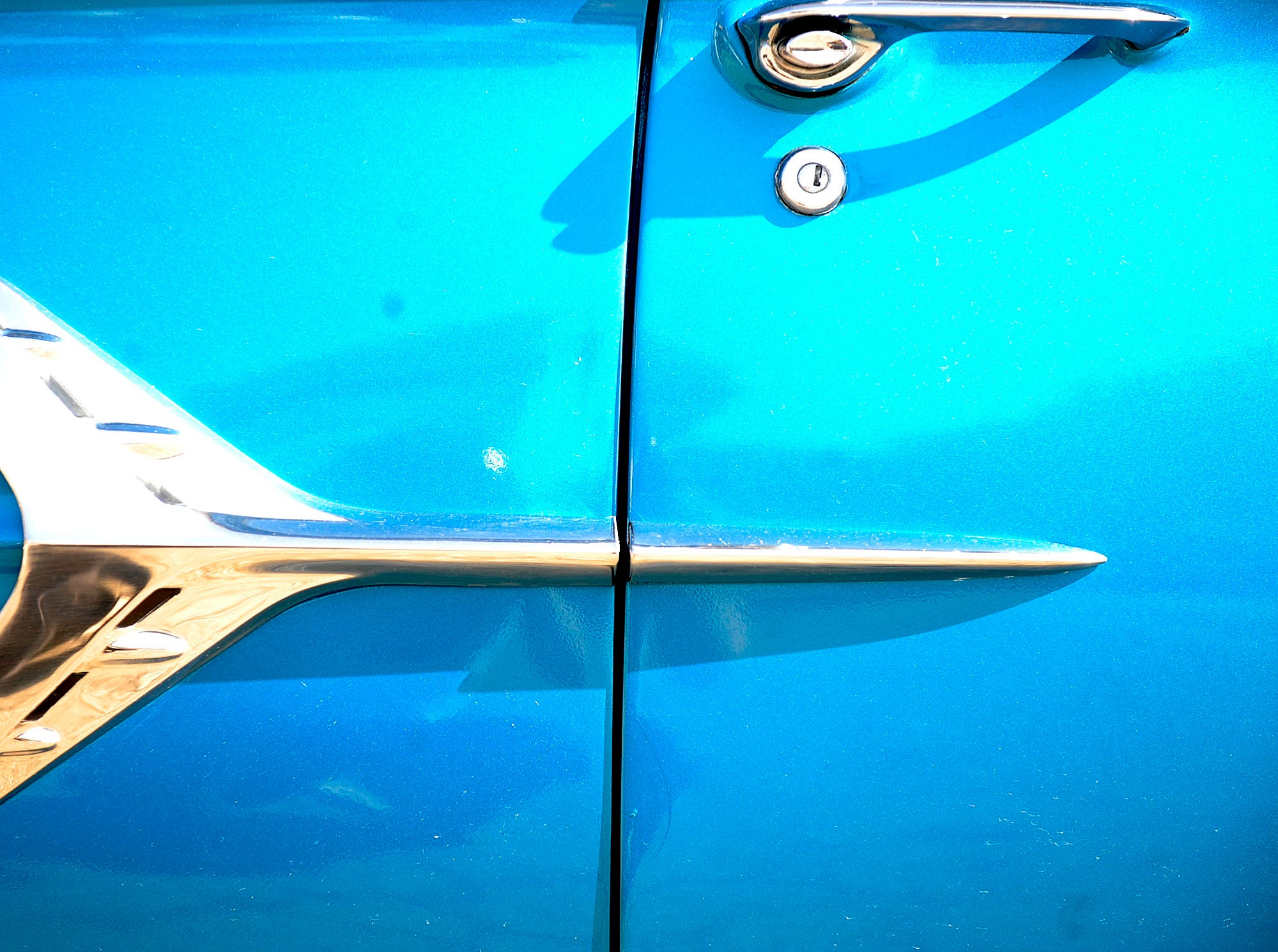 Side panel detail of a 1960 Chevy Impala owned by Jay Harbin of Berkeley, Mich.