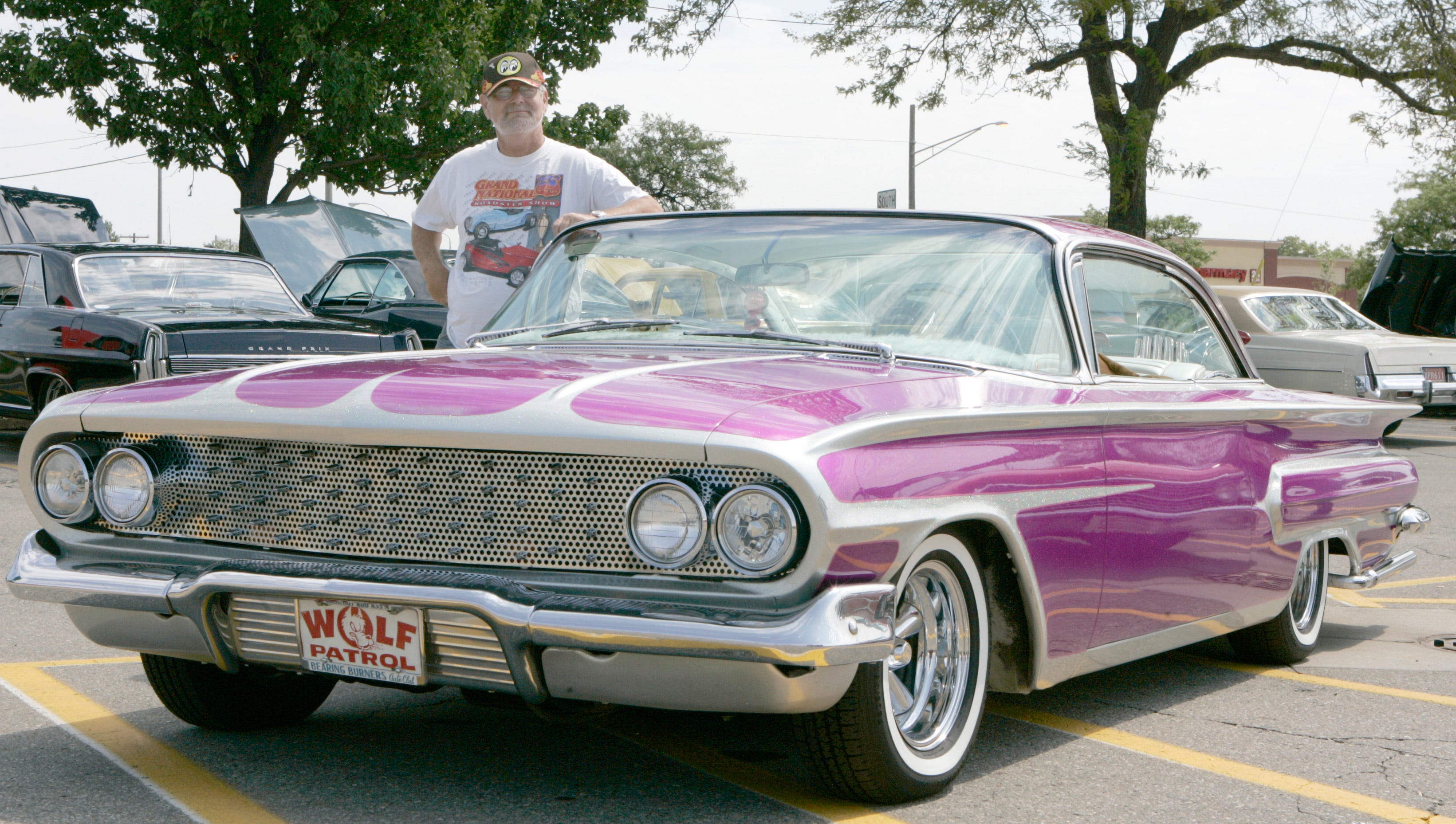 George Lusk of St. Clair Shores with his purple 1960 Chevrolet Impala in Royal Oak, Aug. 14, 2007.