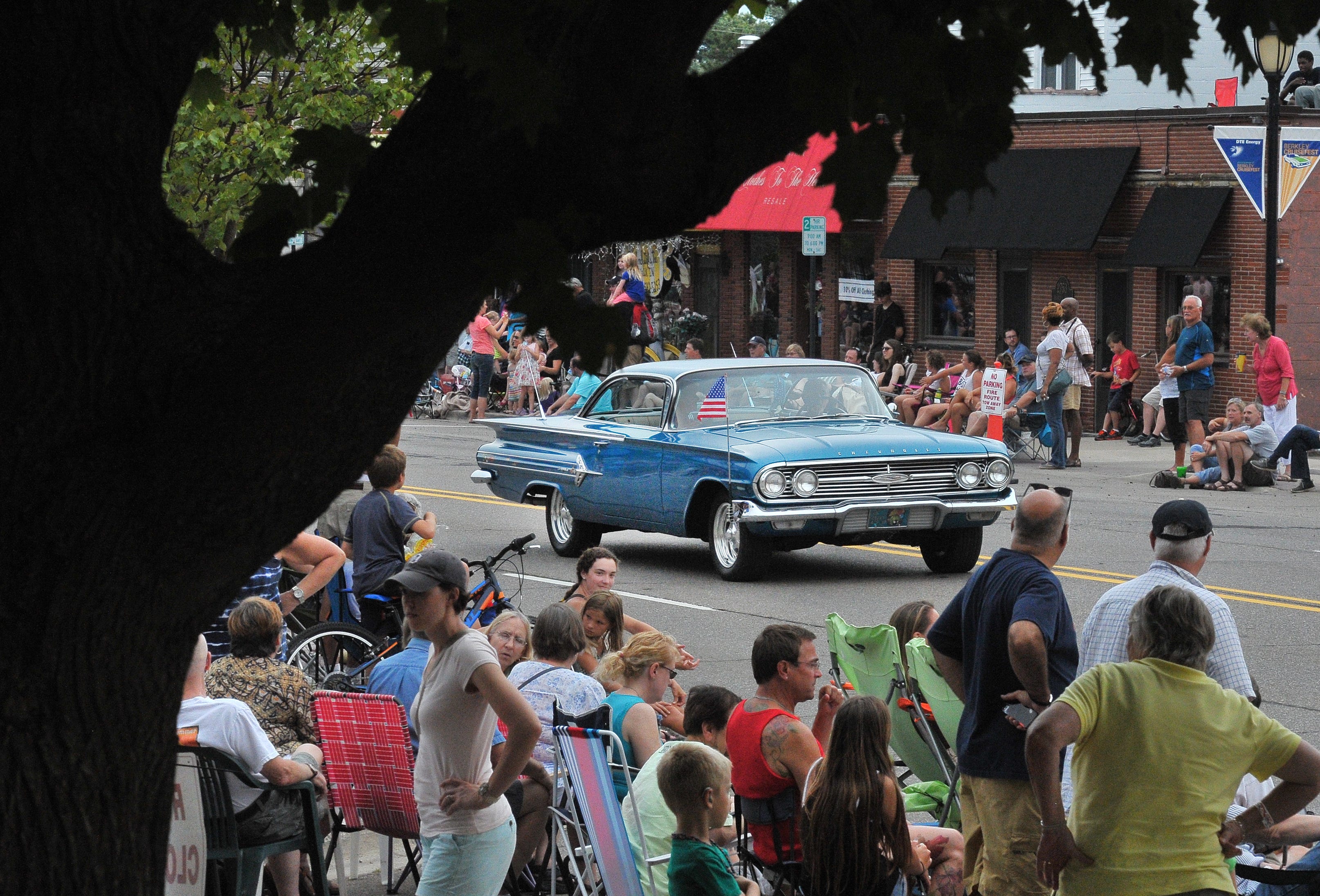 A 1960 Impala makes its way down 12 Mile for the Berkley Cruisefest parade, Aug. 14, 2015.