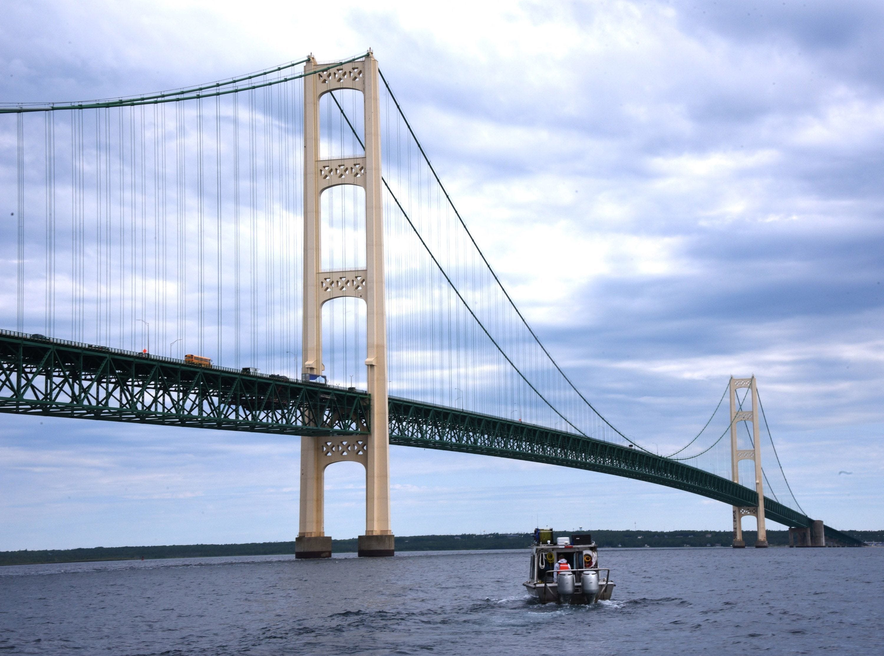 Oil pipeline operator Enbridge moves under the Mackinac Bridge on their way to inspect their controversial Line 5 under the Straits of Mackinac Wednesday, June 8, 2016. Using an autonomous underwater vehicle and a roving underwater vehicle over several days, the entire five-mile-long pipeline, which rests on supports along the bottom of Lake Michigan, will have been covered by both sonar and visual means.