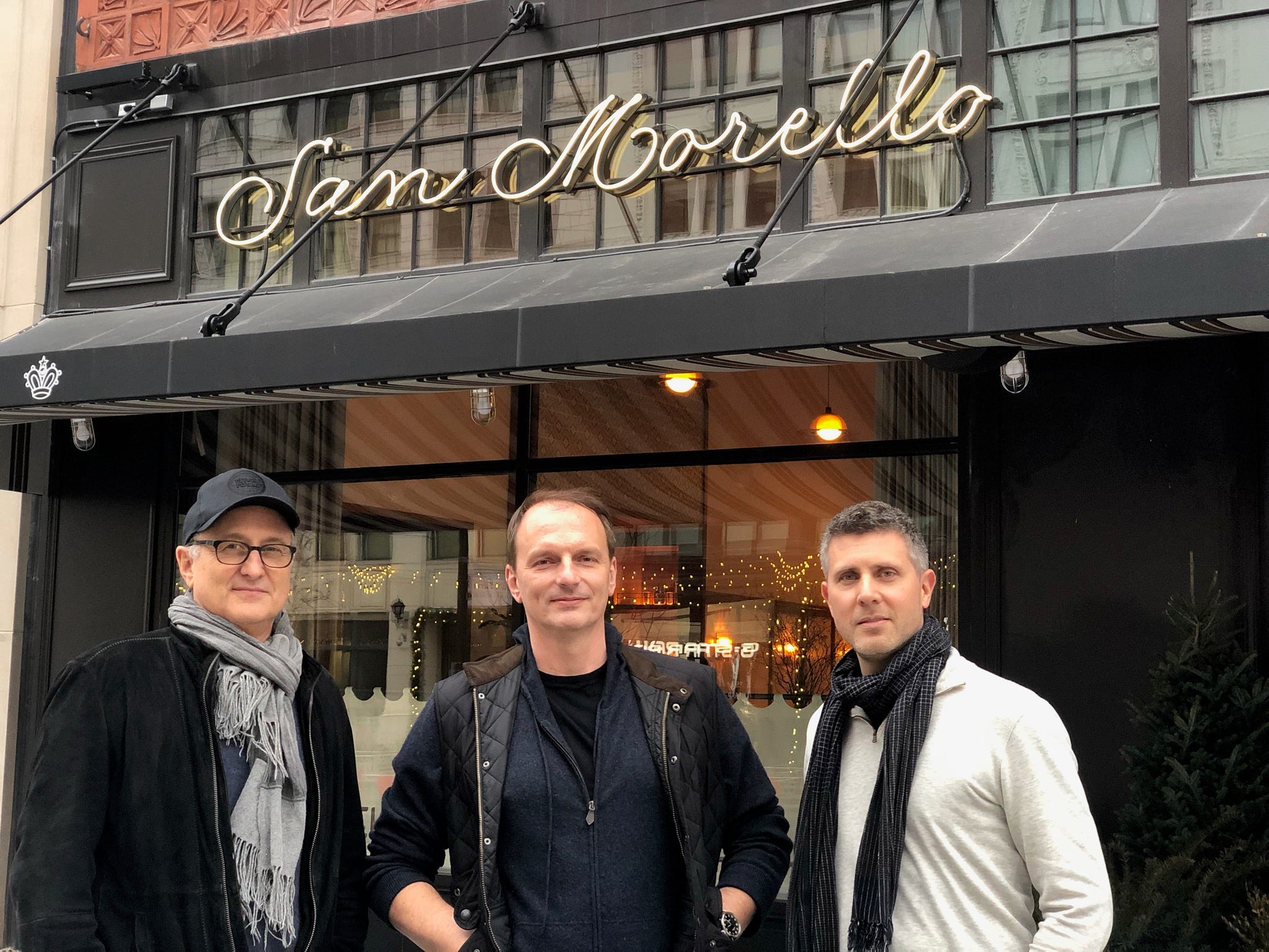 NoHo Hospitality partners Josh Pickard, left, chef Andrew Carmellini and Luke Ostrom stand in front of San Morello at 1400 Woodward in Detroit.