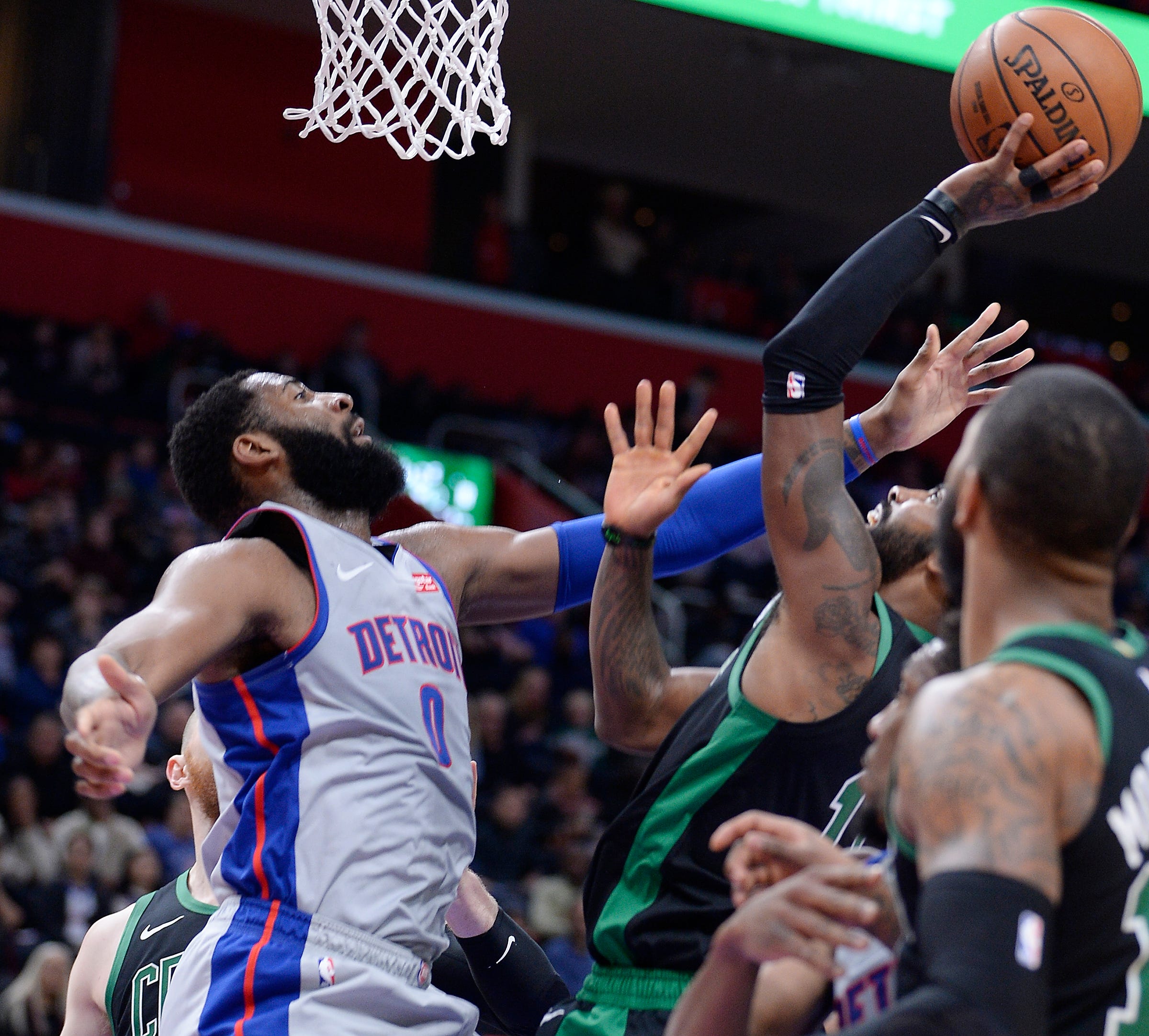 Pistons ' Andre Drummond blocks the shot of Celtics ' Kyrie Irving in the second quarter.