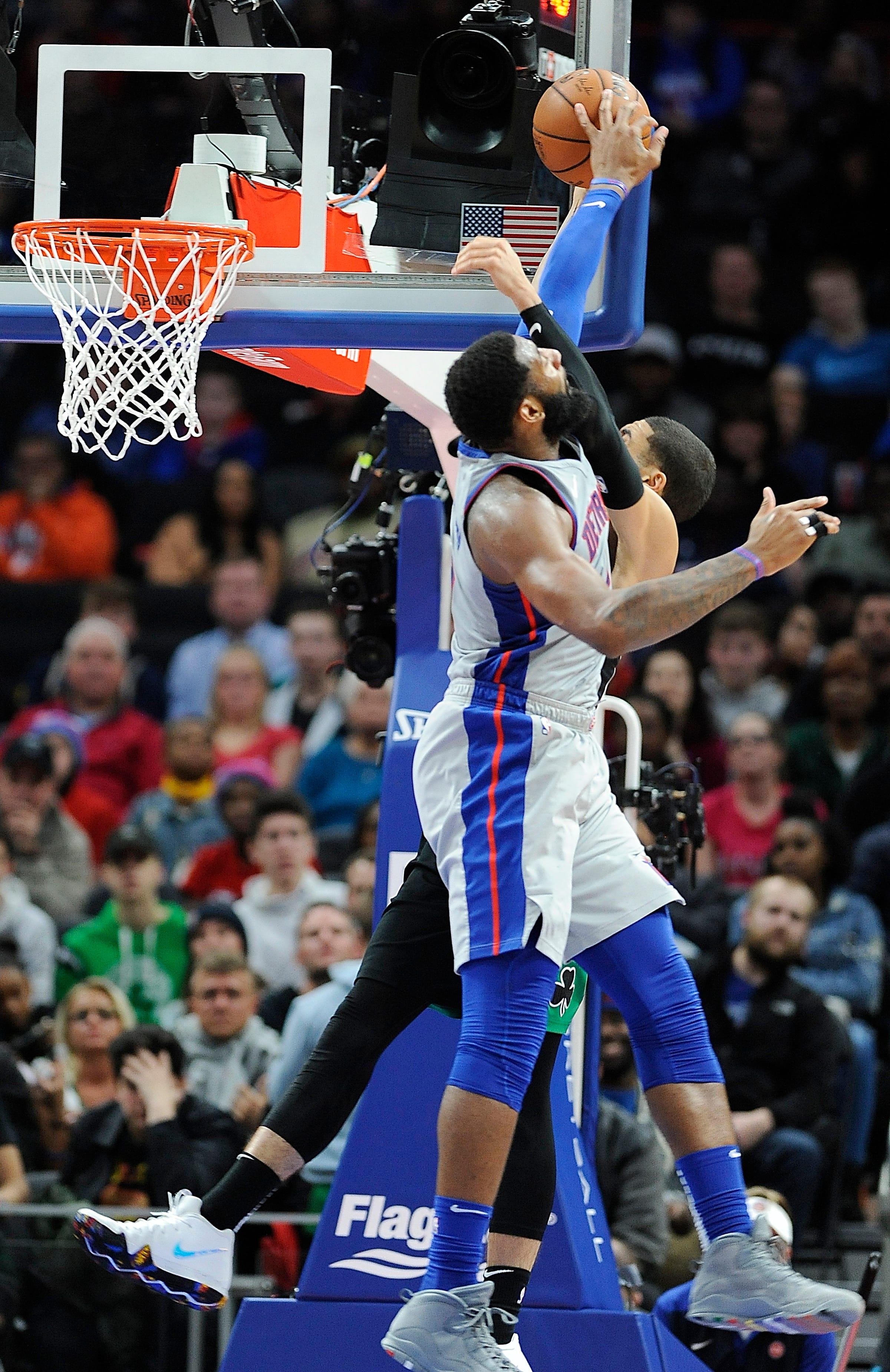 Pistons ' Andre Drummond blocks the dunk attempt by Celtics ' Jayson Tatum in the fourth quarter. Drummond had 19 points, 20 rebounds and five block shots