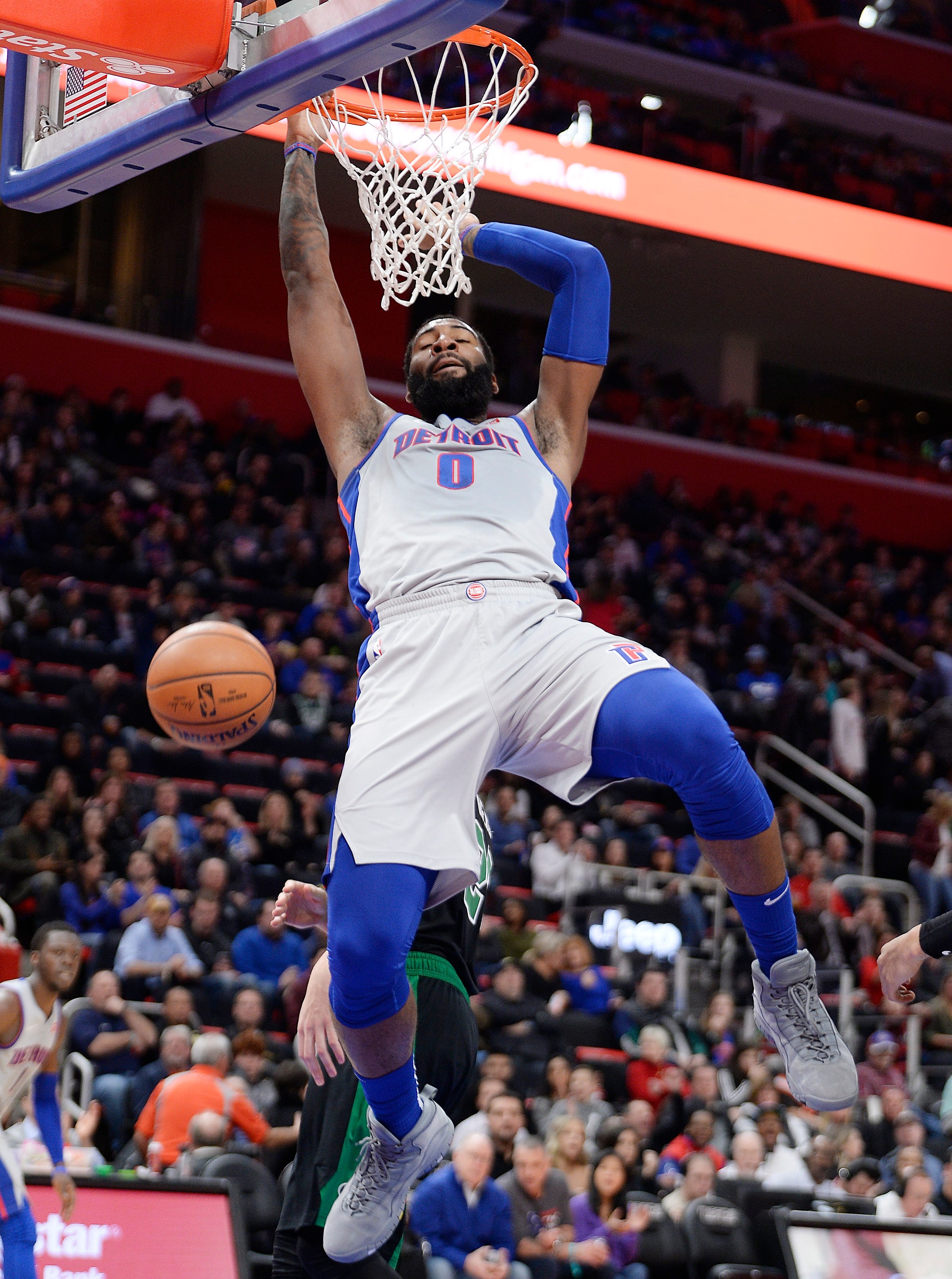 Pistons ' Andre Drummond dunks over Celtics ' Daniel Theis in the third quarter. Drummond had 19 points, 20 rebounds and five block shots.
