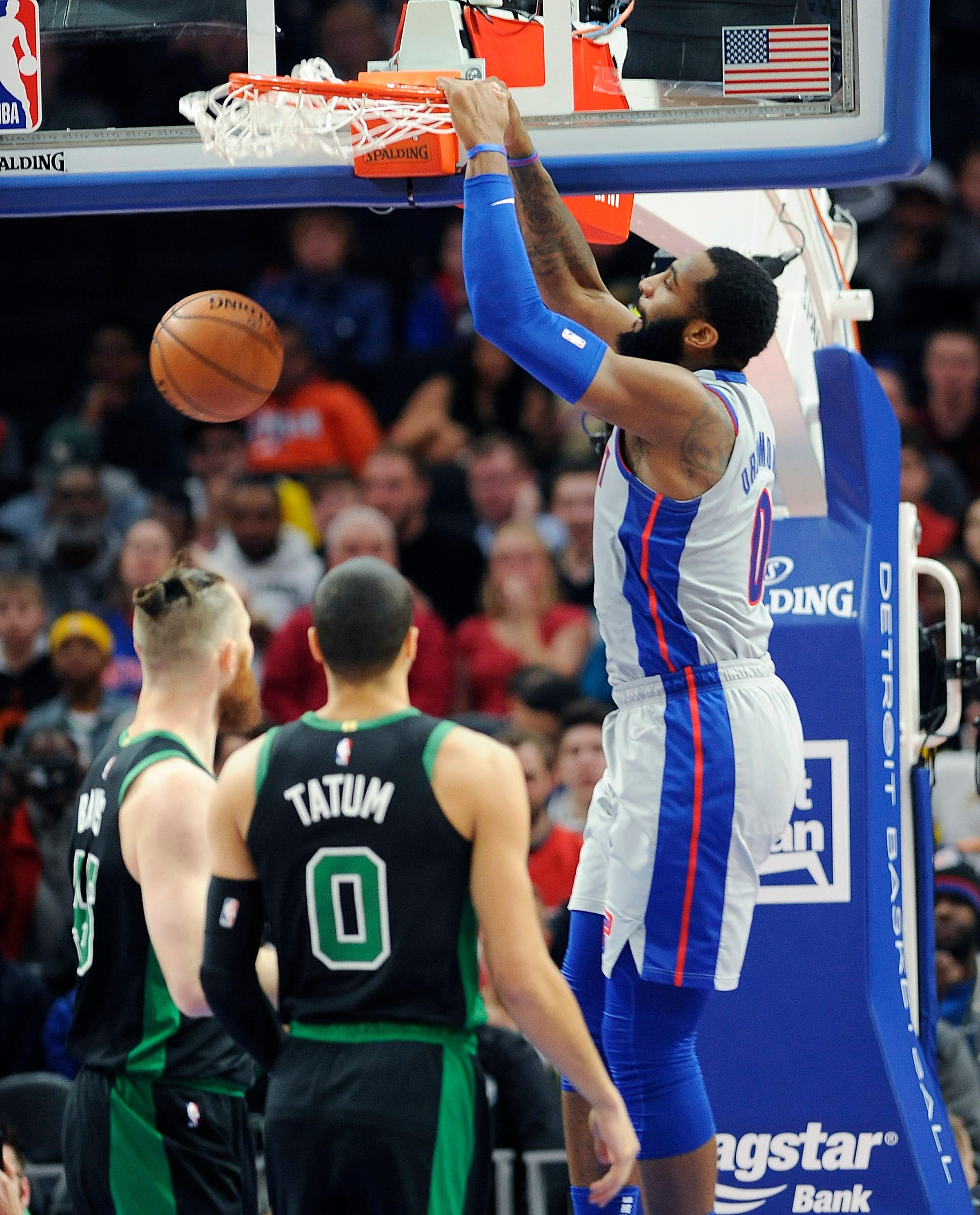 Pistons' Andre Drummond dunks over Celtics' Aaron Baynes in the first quarter.