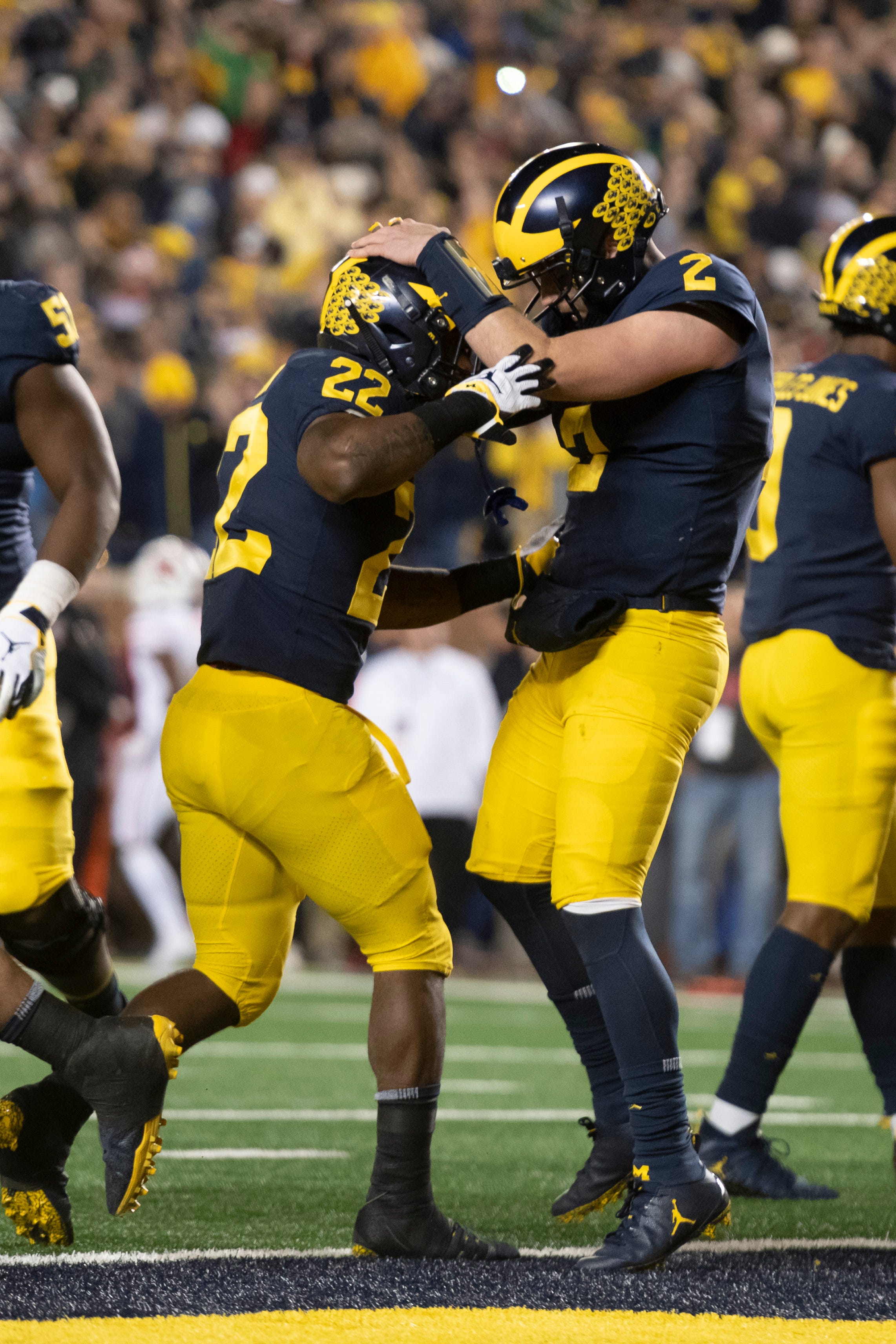 Michigan running back Karan Higdon, left, and quarterback Shea Patterson celebrate after Higdon ran for a touchdown in the second quarter against Wisconsin.