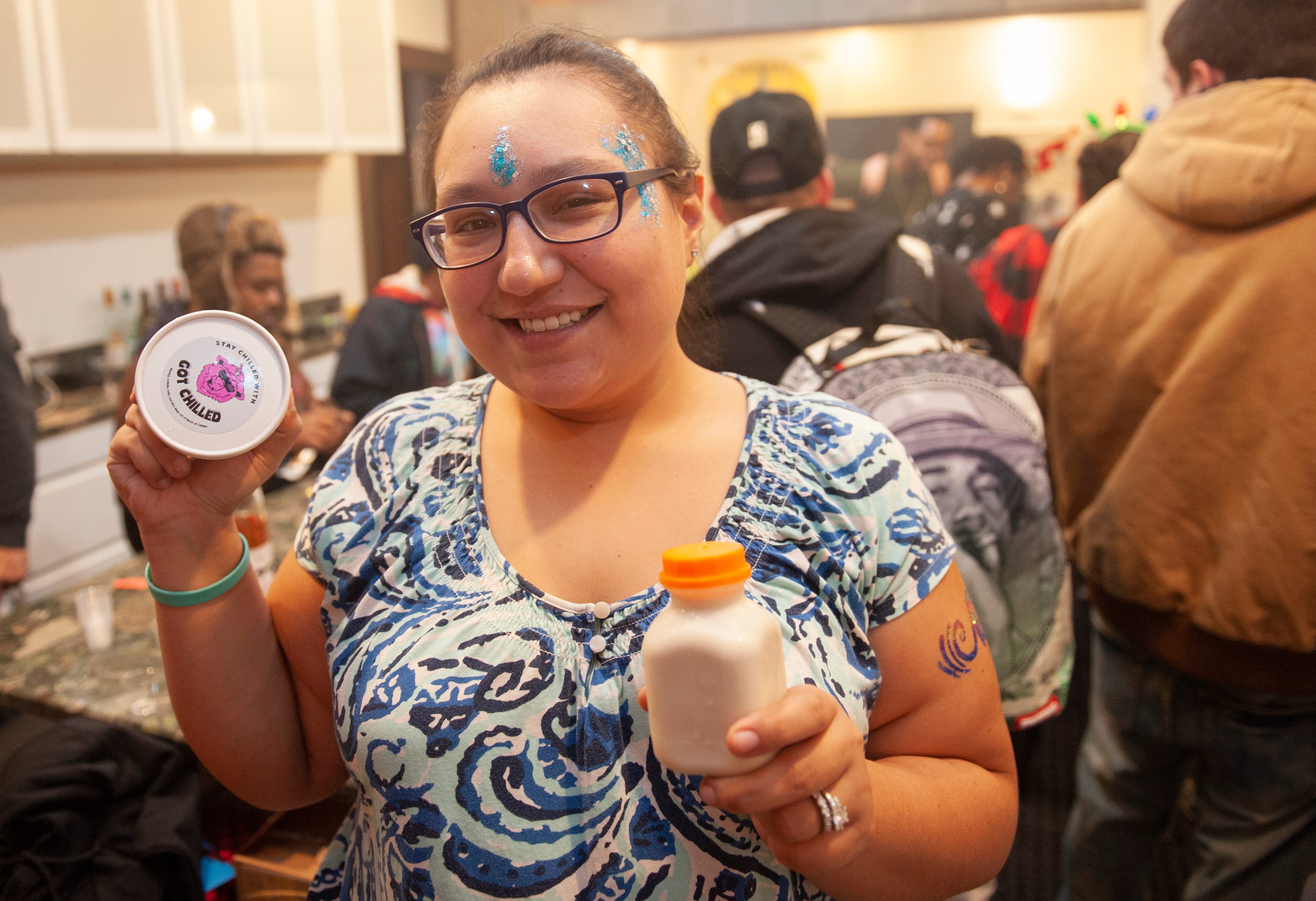 Brittany Gibler of Warren shows off her "Got Chilled" cannabis-infused dairy products, which include ice cream, sorbet and coffee creamers, during "The Art of Cannabis" tasting and art exhibition at the Cannabis Counsel in Detroit on Saturday, Dec. 22, 2018. Guests, who were required to be Michigan residents age 21 or older or medical marijuana card holders, bought a ticket to the event, but once inside there were free samples of edibles and smokeables.