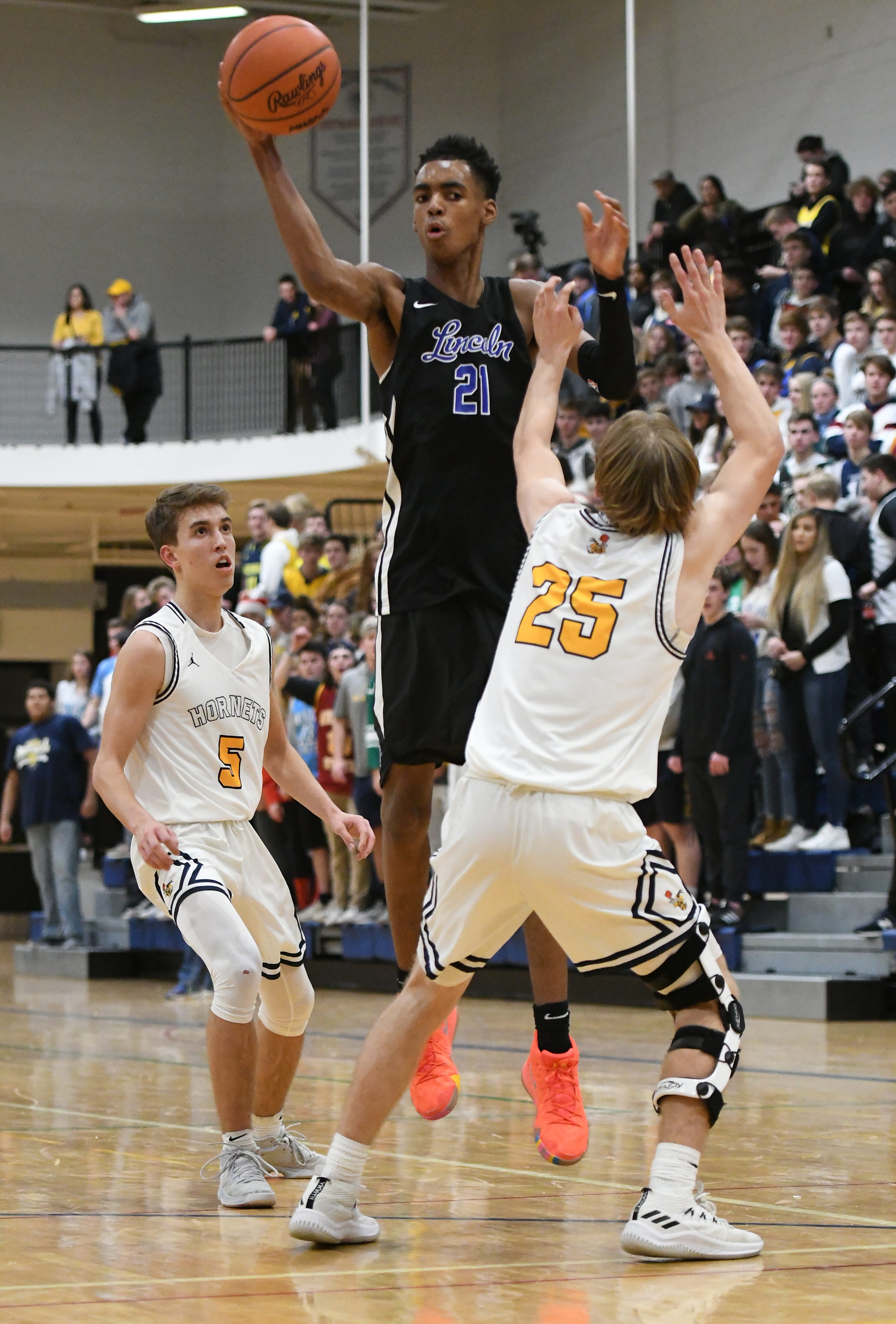 Lincoln High School freshman basketball player Emoni Bates zips a pass to a teammate.