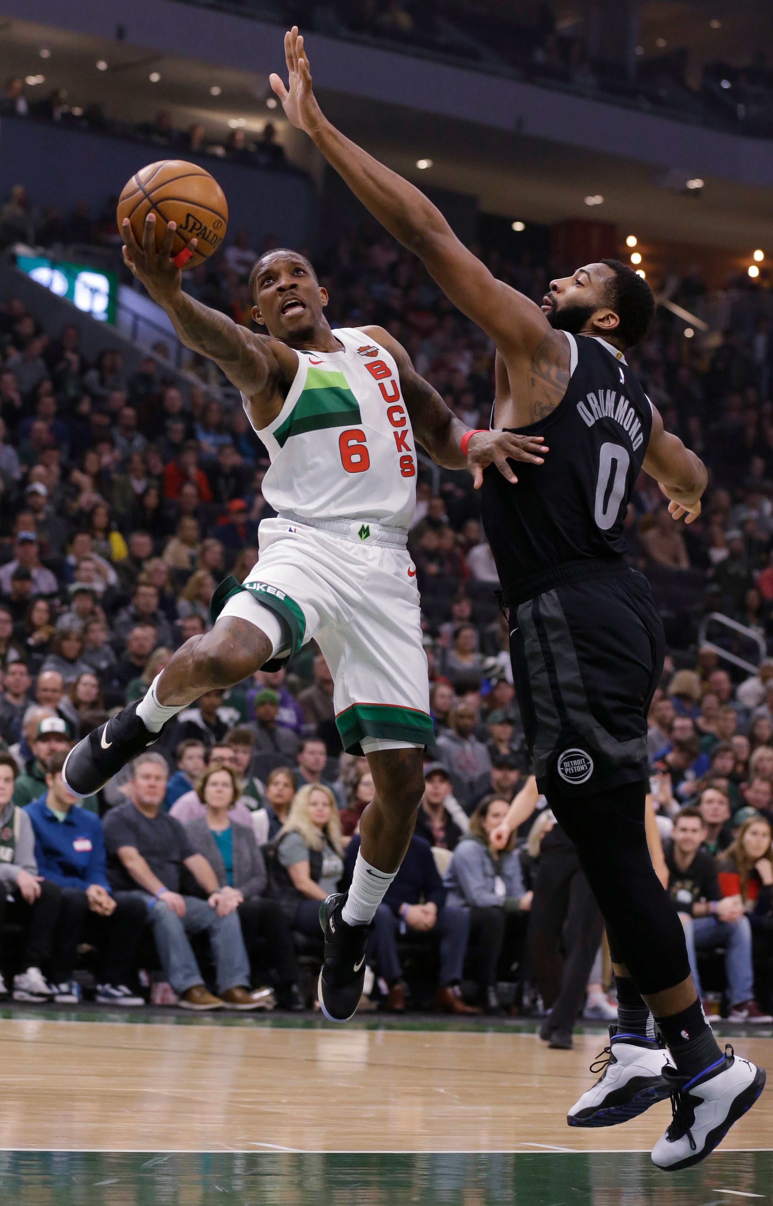 Milwaukee Bucks' Eric Bledsoe (6) drives against Detroit Pistons' Andre Drummond during the first half of Tuesday's game.