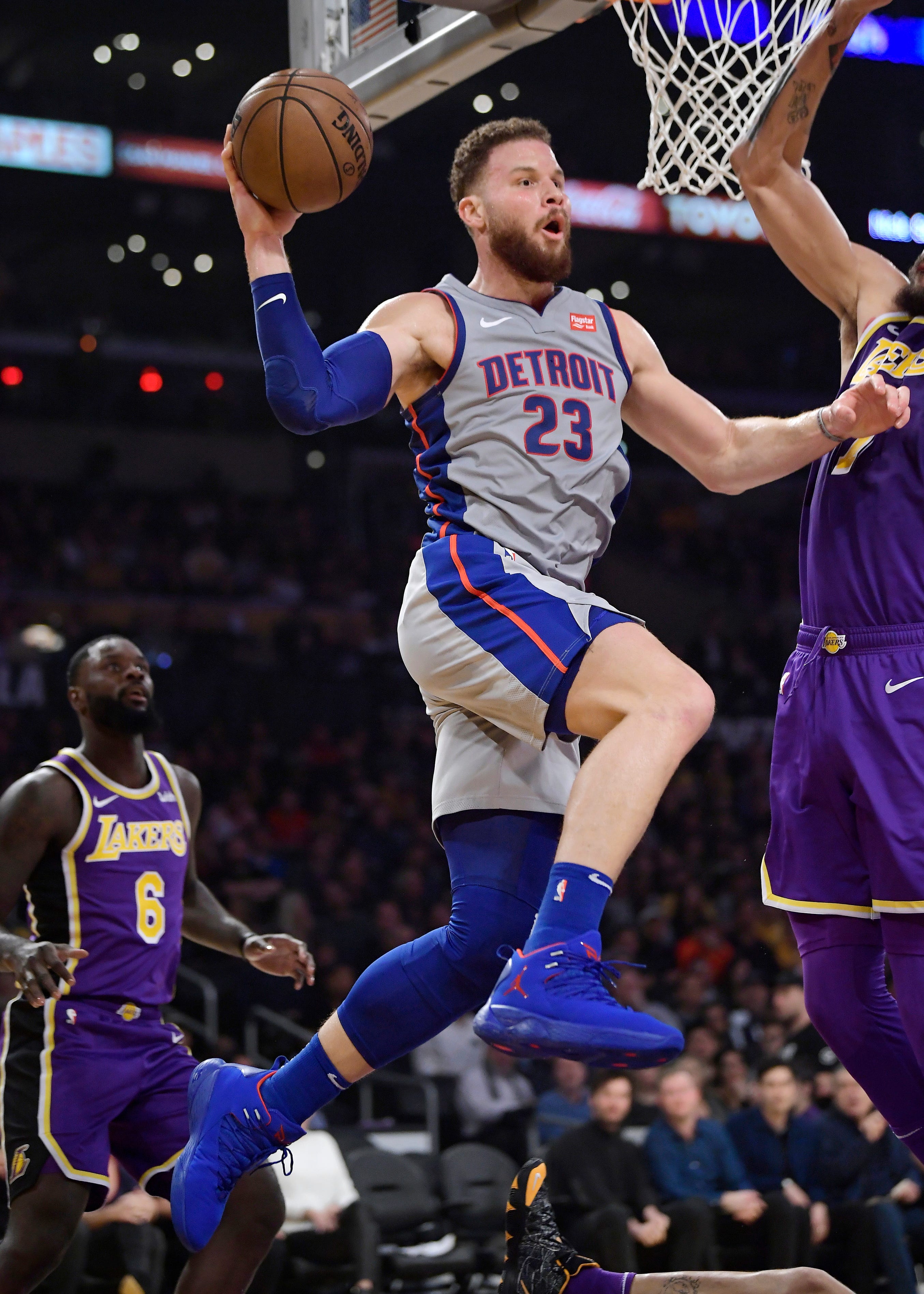 Detroit Pistons forward Blake Griffin looks to pass the ball as Los Angeles Lakers guard Lance Stephenson, left, defends during the first half.