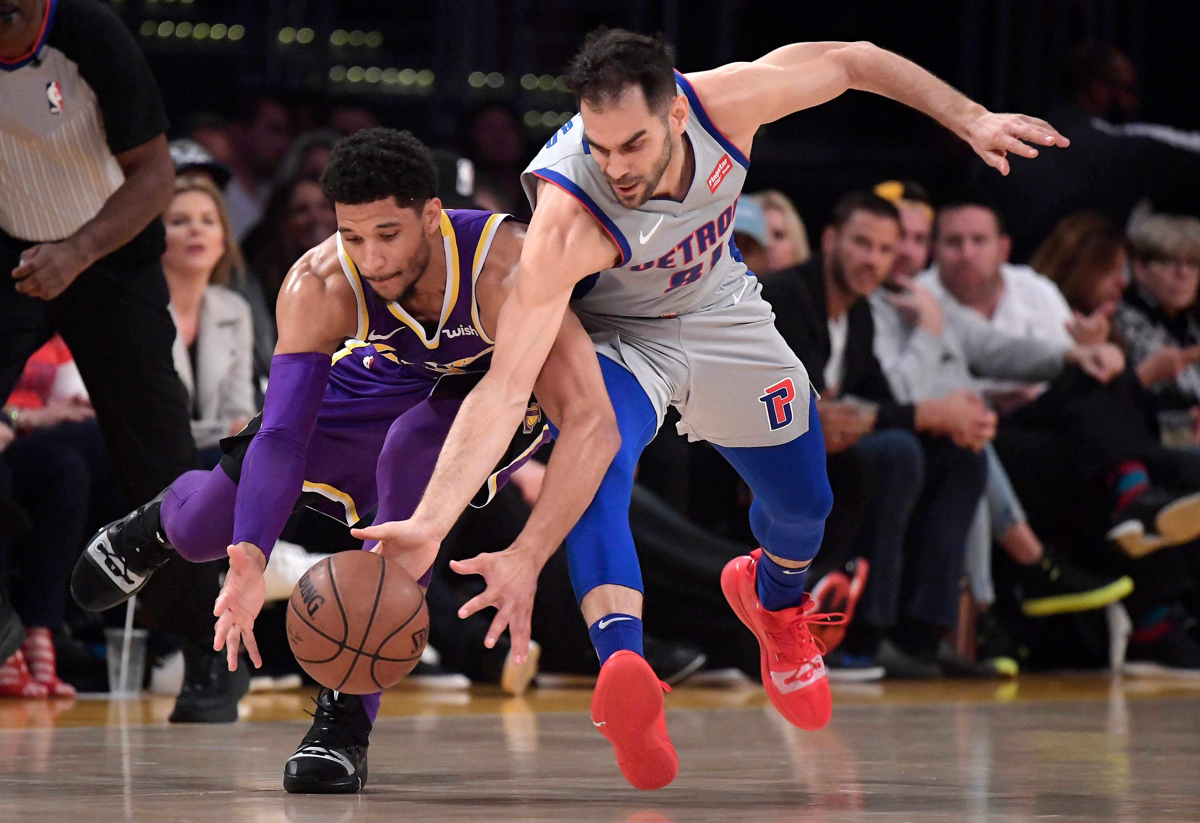 Los Angeles Lakers guard Josh Hart, left, and Detroit Pistons guard Jose Calderon go after a loose ball during the first half of an NBA basketball game Wednesday, Jan. 9, 2019, in Los Angeles. The Lakers won the game, 113-100.