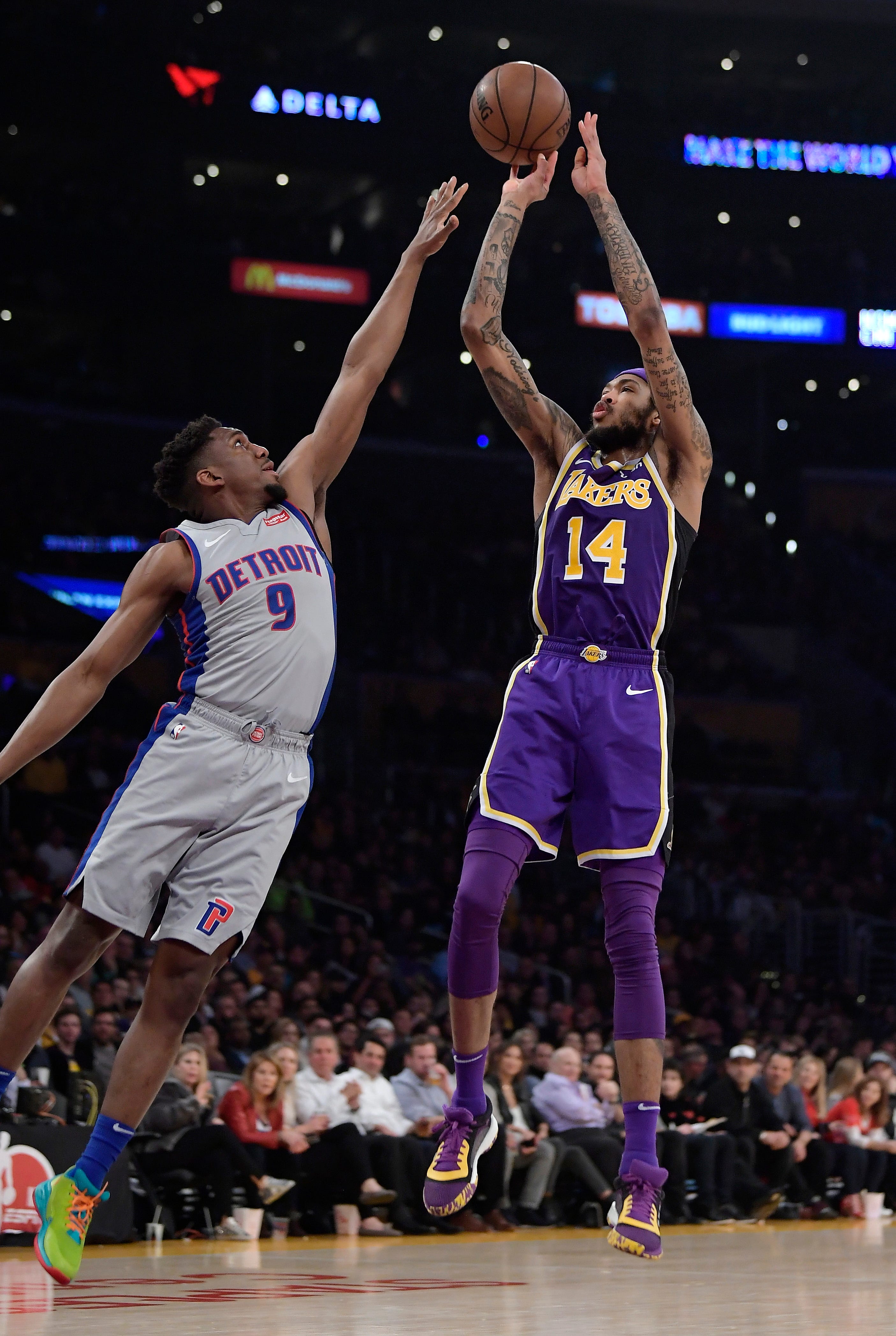 Los Angeles Lakers forward Brandon Ingram, right, shoots as Detroit Pistons guard Langston Galloway defends during the second half.