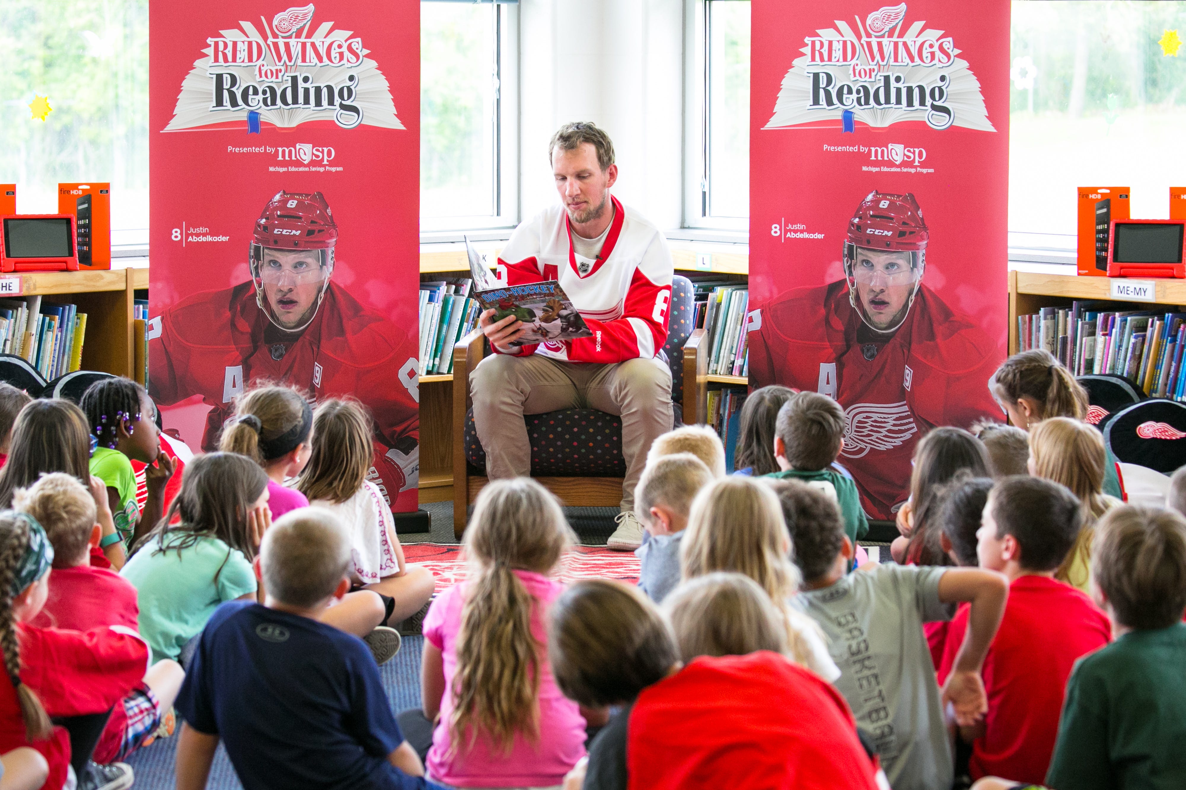 Justin Abdelkader reads to young students as part of his Abby’s All-Stars program.