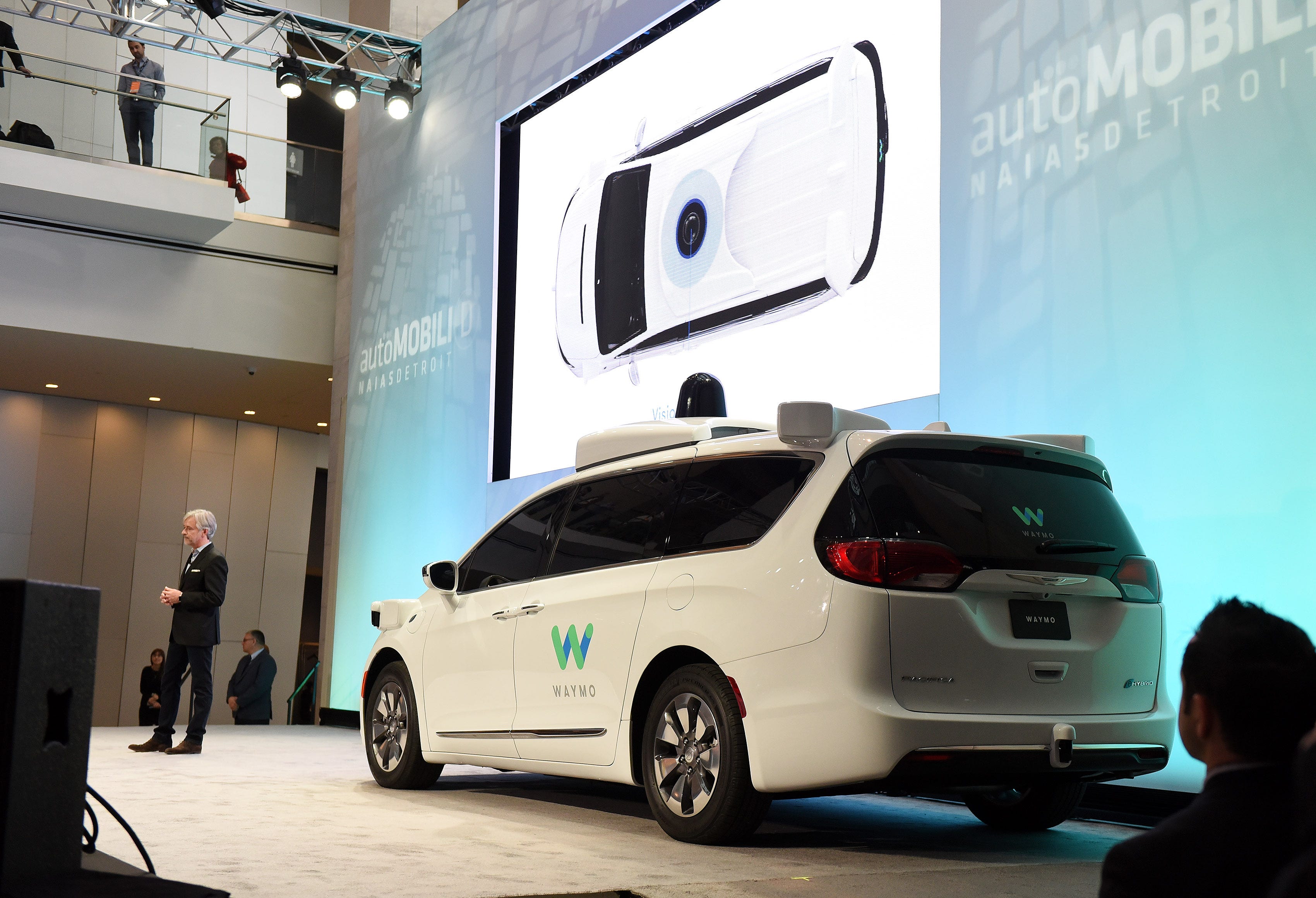 A Chrysler Pacifica is outfitted with Waymo LLC's self-driving system. The Google spinoff says it will invest up to $13.6 million in a facility in Detroit to integrate its technology into automaker partners' vehicles.
