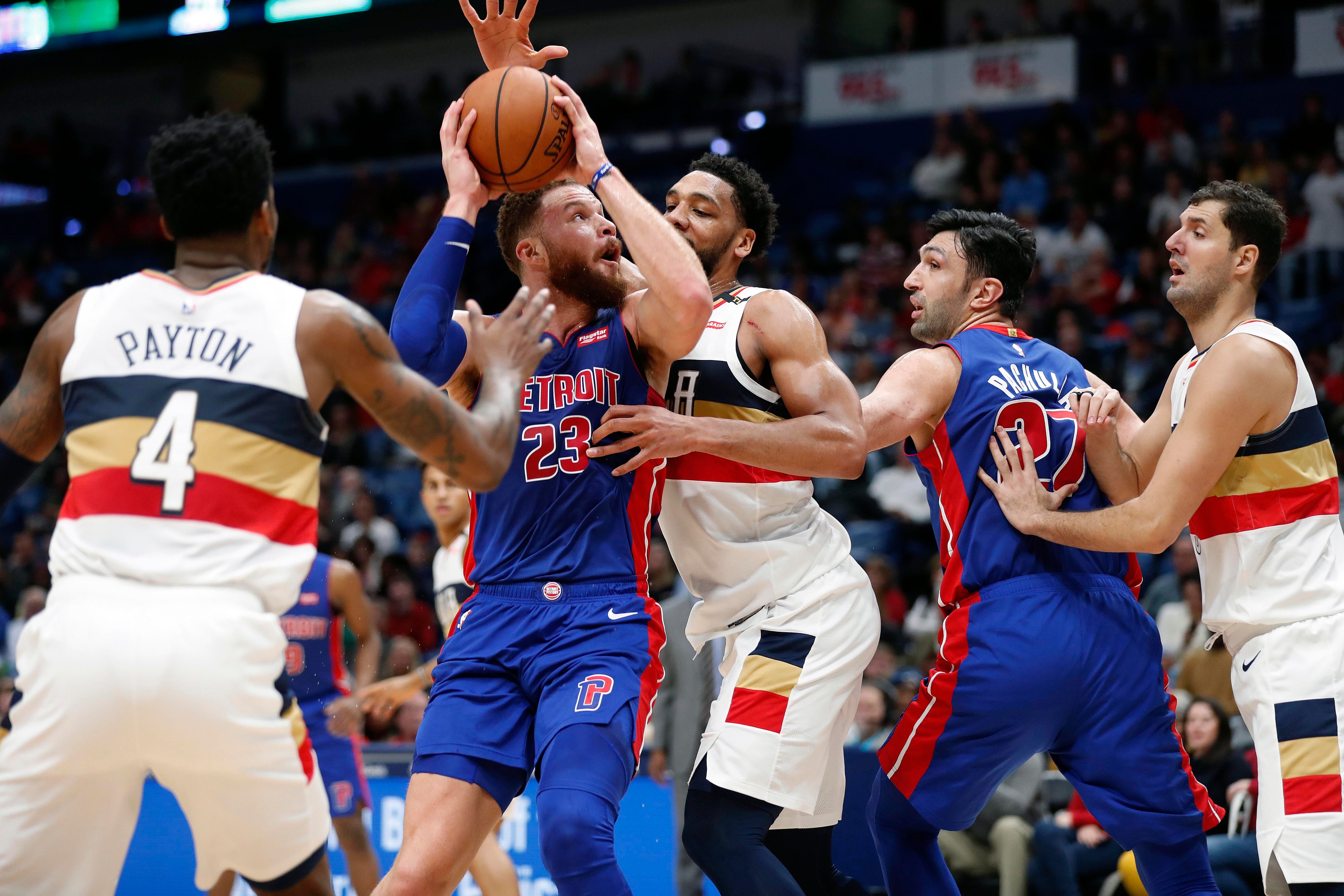 Detroit Pistons forward Blake Griffin (23) moves to the basket against New Orleans Pelicans center Jahlil Okafor in the first half.