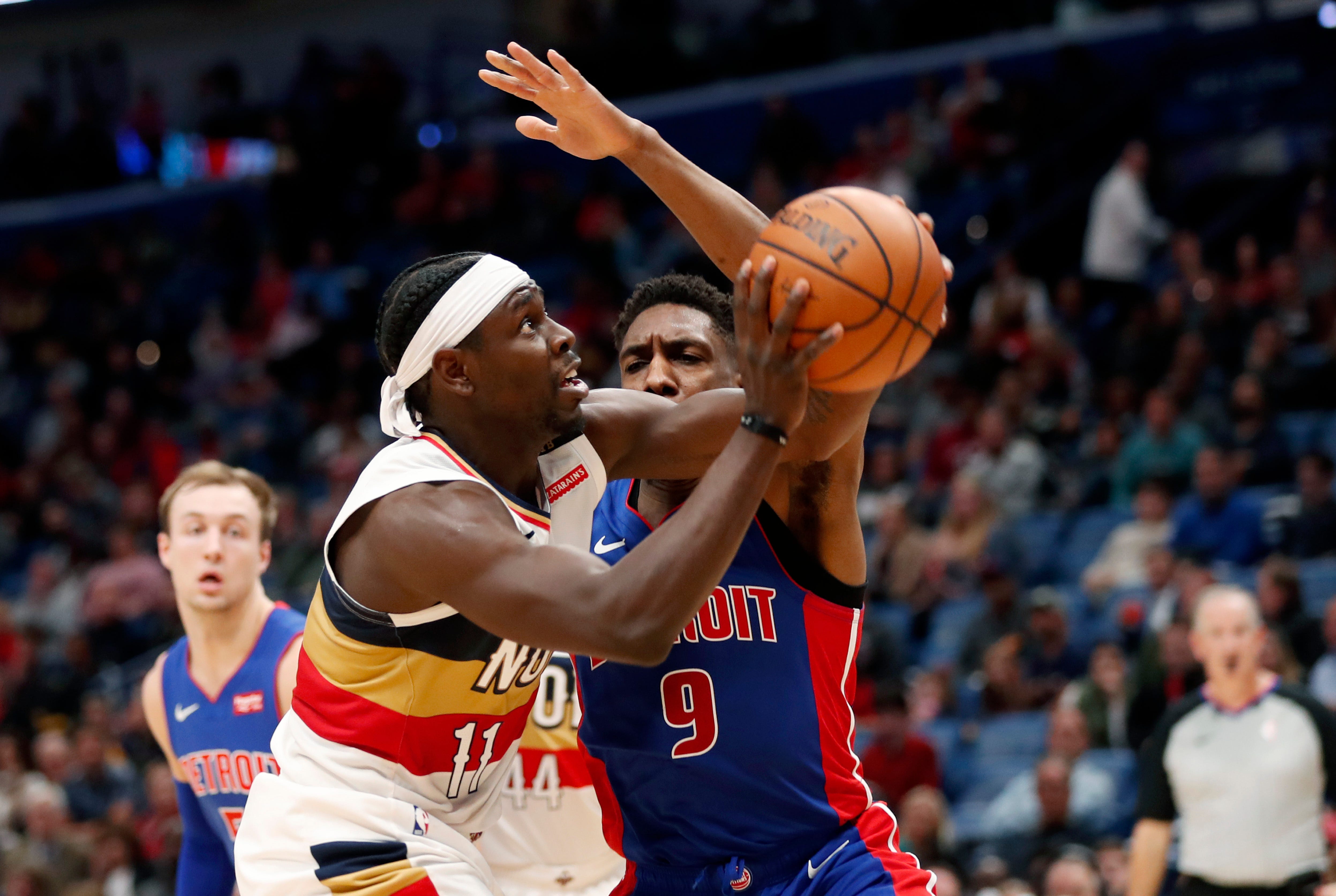 New Orleans Pelicans guard Jrue Holiday (11) drives to the basket against Detroit Pistons guard Langston Galloway (9) during the second half.