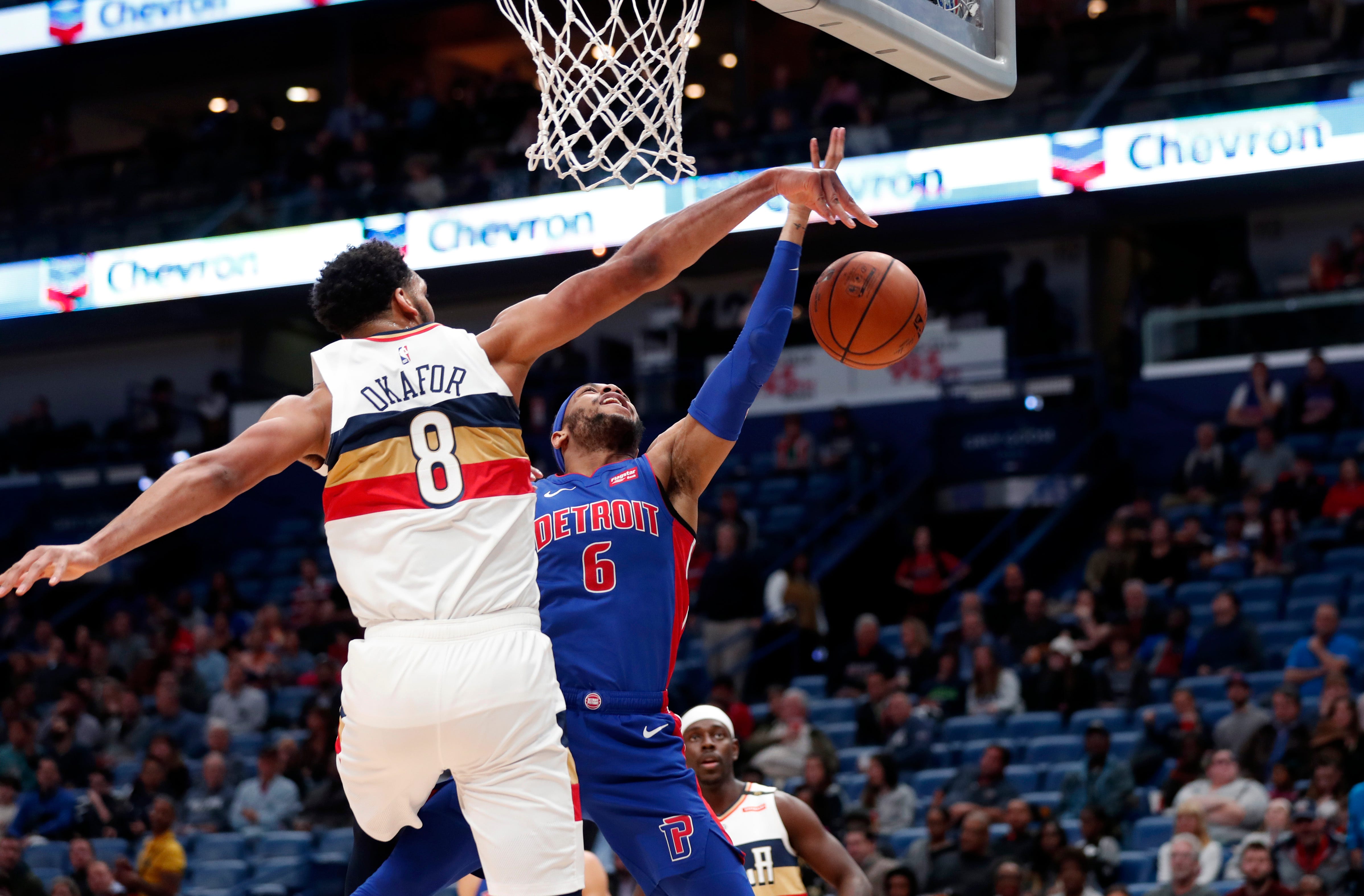 New Orleans Pelicans center Jahlil Okafor (8) blocks a shot by Detroit Pistons guard Bruce Brown (6) in the first half.