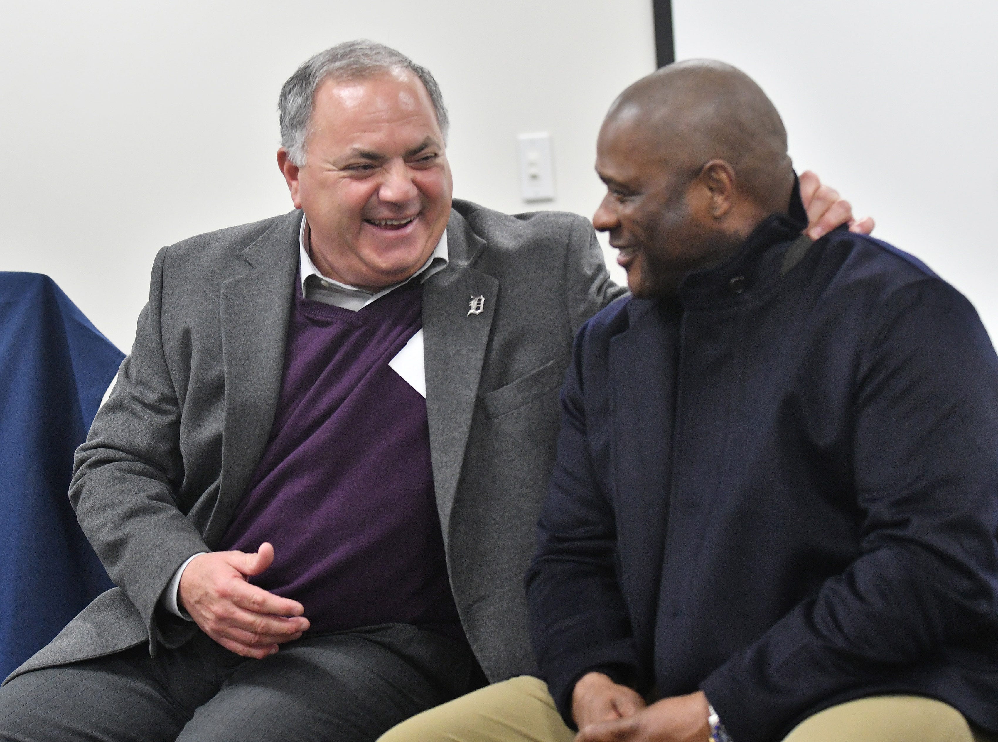 Tigers executive vice president of baseball operations and general manager Al Avila talks with hitting coach Lloyd McClendon, right, during a stop on the 2019 Detroit Tigers Winter Caravan at the John D. Dingell VA Medical Center in Detroit on Jan. 24, 2019.