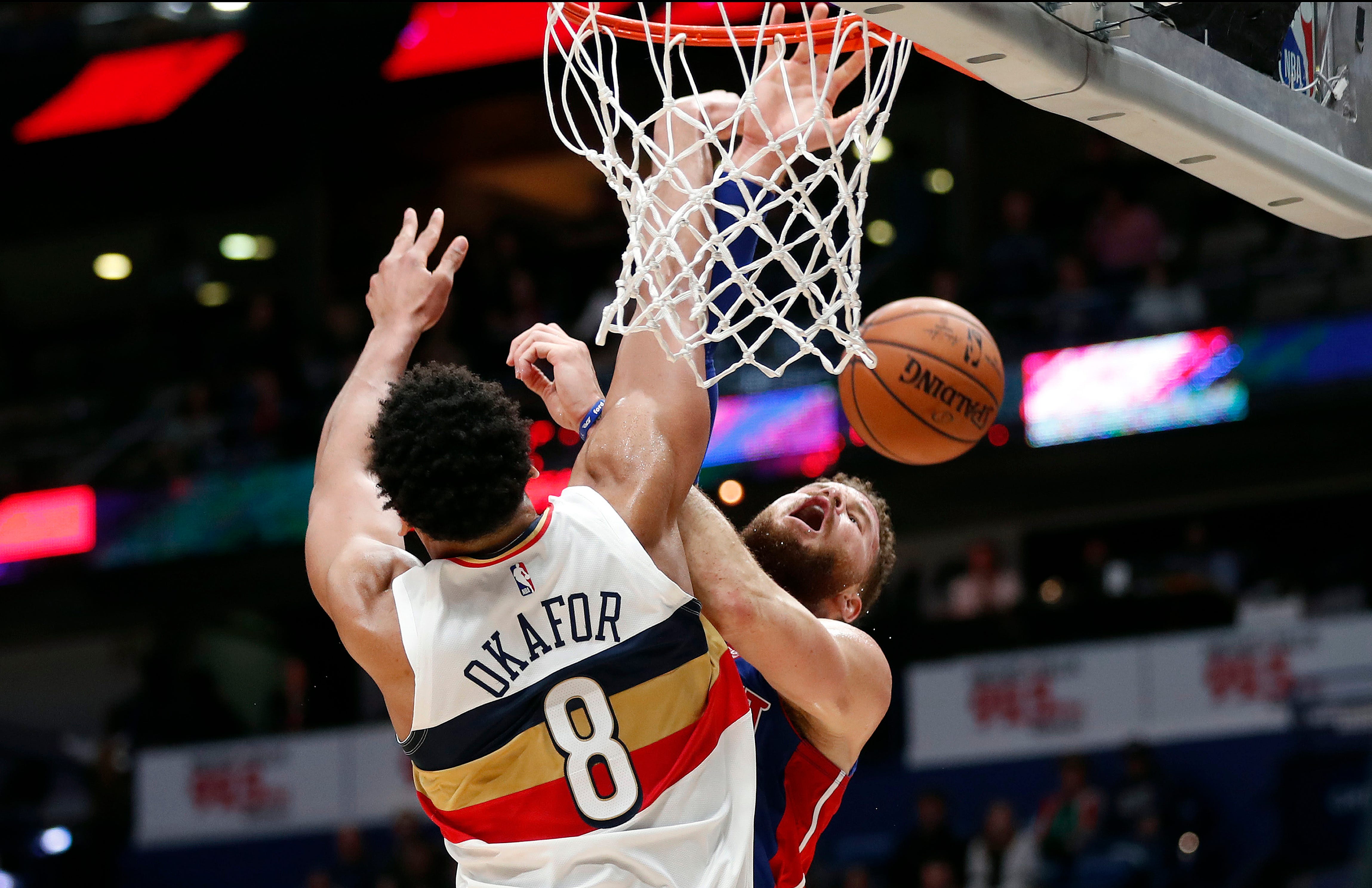 Detroit Pistons forward Blake Griffin is blocked by New Orleans Pelicans center Jahlil Okafor (8) as he goes to the basket in the first half in New Orleans, Wednesday, Jan. 23, 2019.