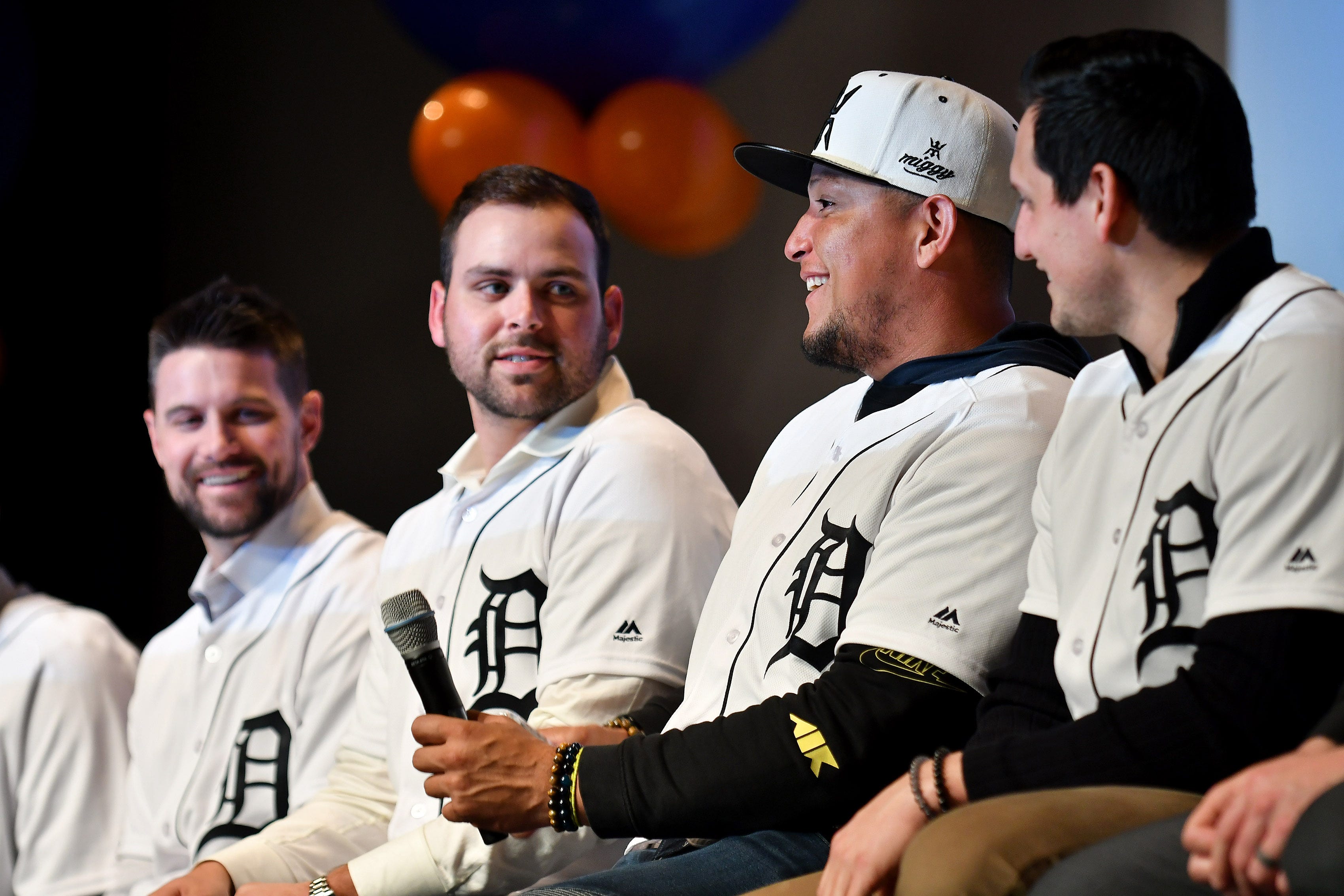 Tigers' Michael Fulmer, left, looks over while Miguel Cabrera smiles and pauses while answering a question as to how many home runs he has hit in his career (465) at a kids rally at Novi High School.