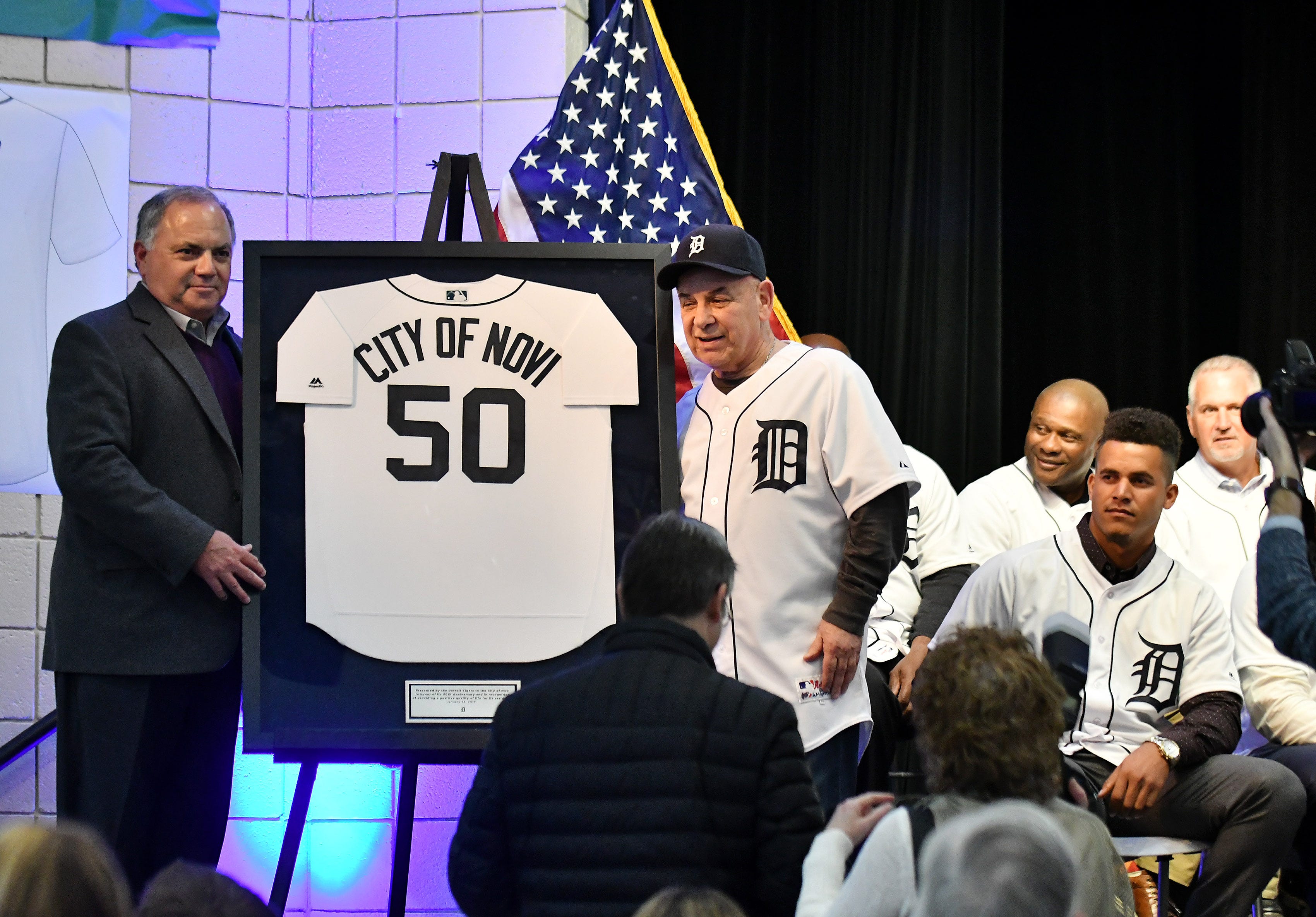 Tigers executive vice president of baseball operations and general manager Al Avila, left, and Novi mayor Bob Gatt with a jersey gift from the Tigers at the Novi Civic Center.