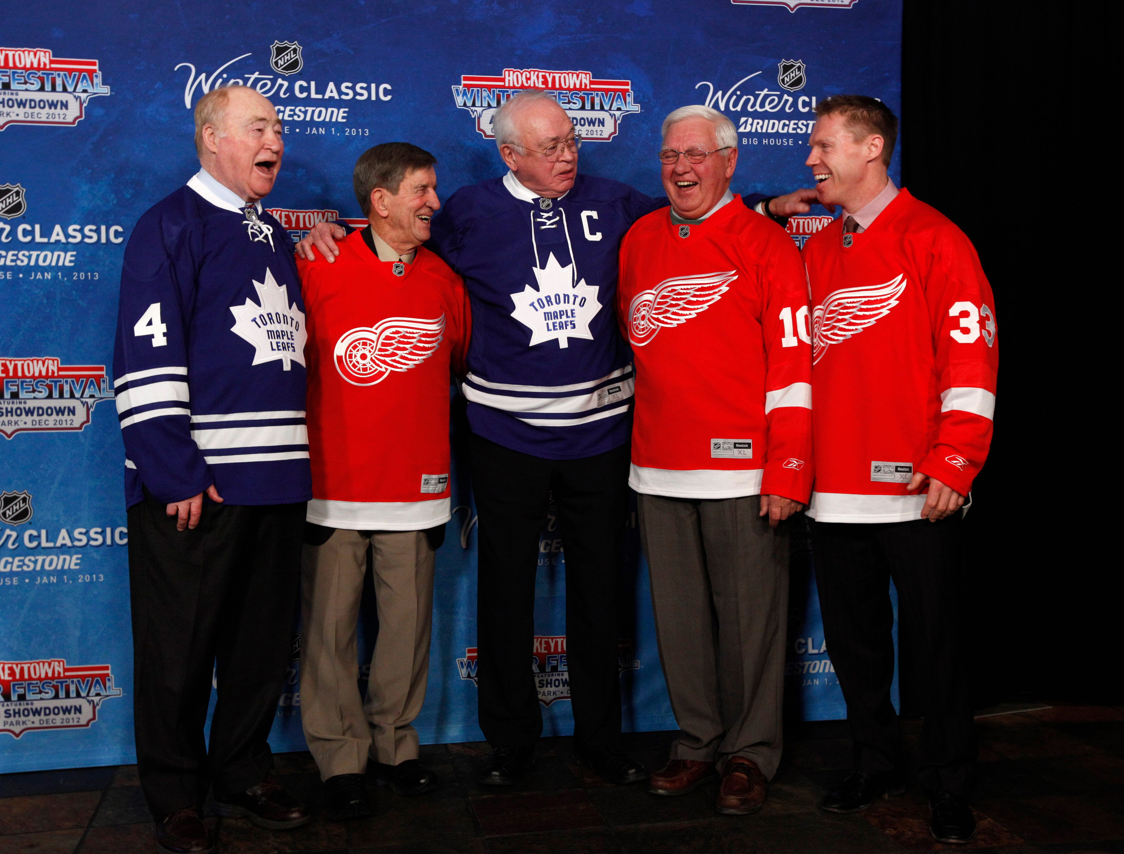 From left, Red Kelly, Ted Lindsay, George Armstrong, Alex Delvecchio and Kris Draper pose for photos during the announcement of the NHL Winter Classic hockey game at Comerica Park  in Detroit on Feb. 9, 2012.
