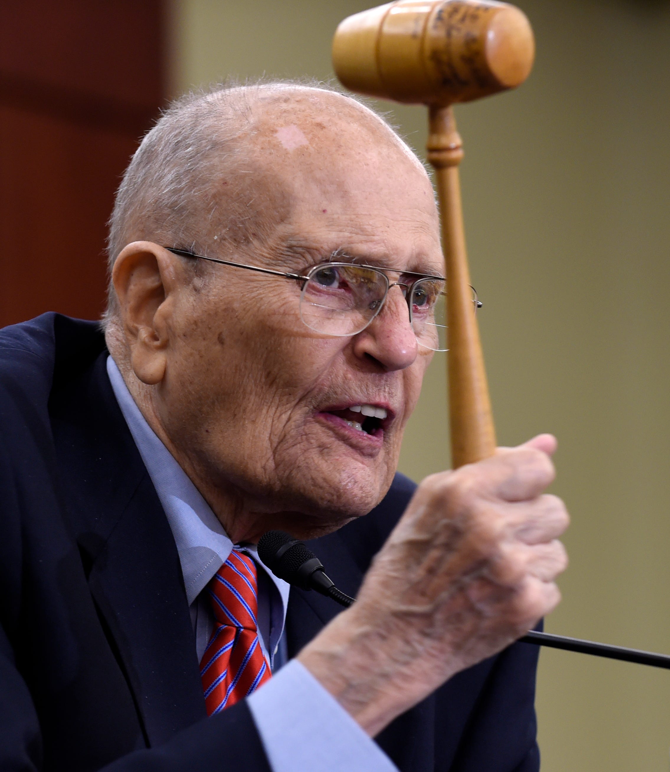 Former Michigan Rep. John Dingell holds up the gavel he used 50 years ago when Medicare legislation was passed, as he speaks at an event marking the 50th anniversary of Medicare and Medicaid,  July 29, 2015, on Capitol Hill.