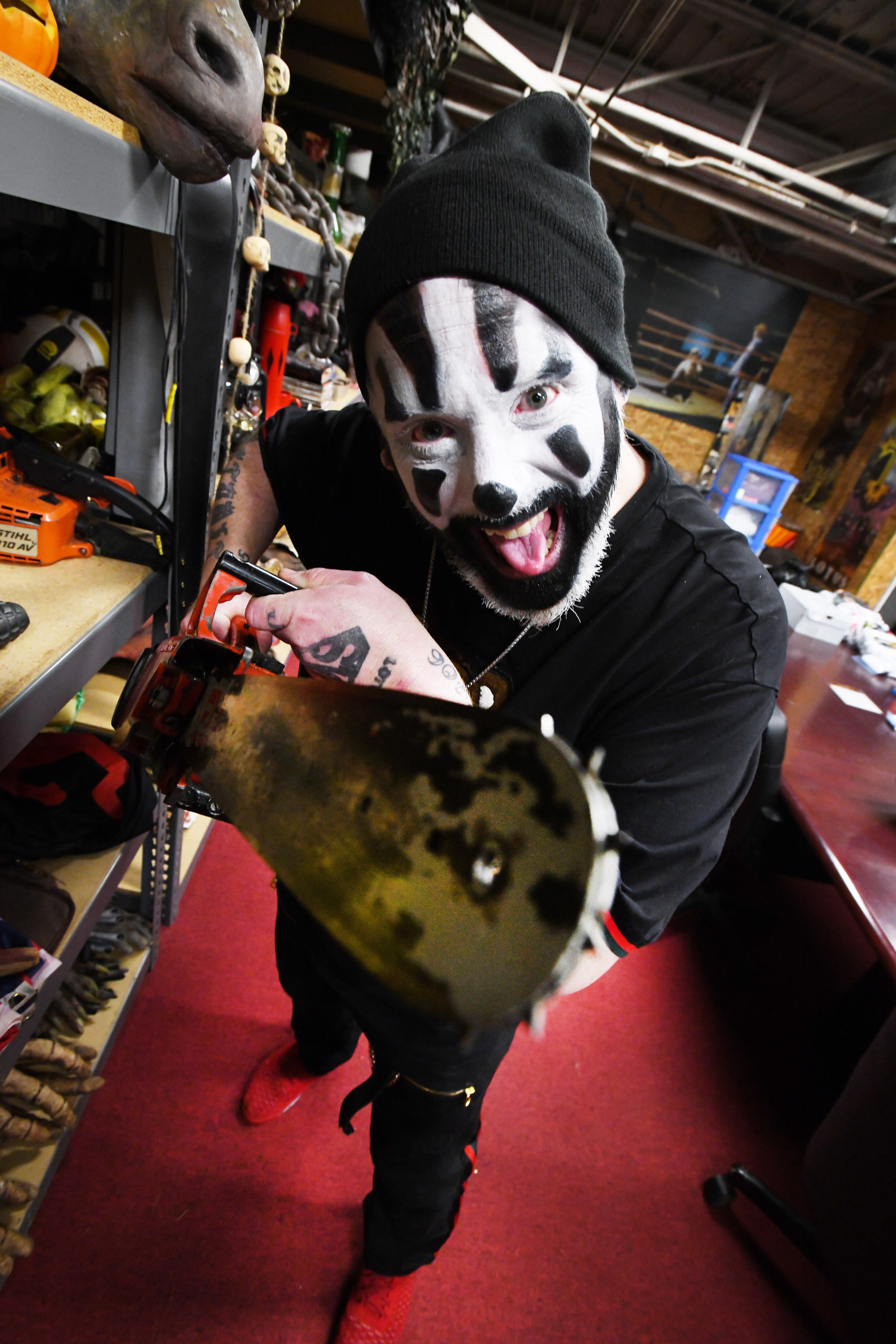 Violent J, aka Joseph Bruce of Insane Clown Posse, shows off costume storage where outfits and various paraphernalia, including a chainsaw prop, are stored from their elaborate shows and tours.