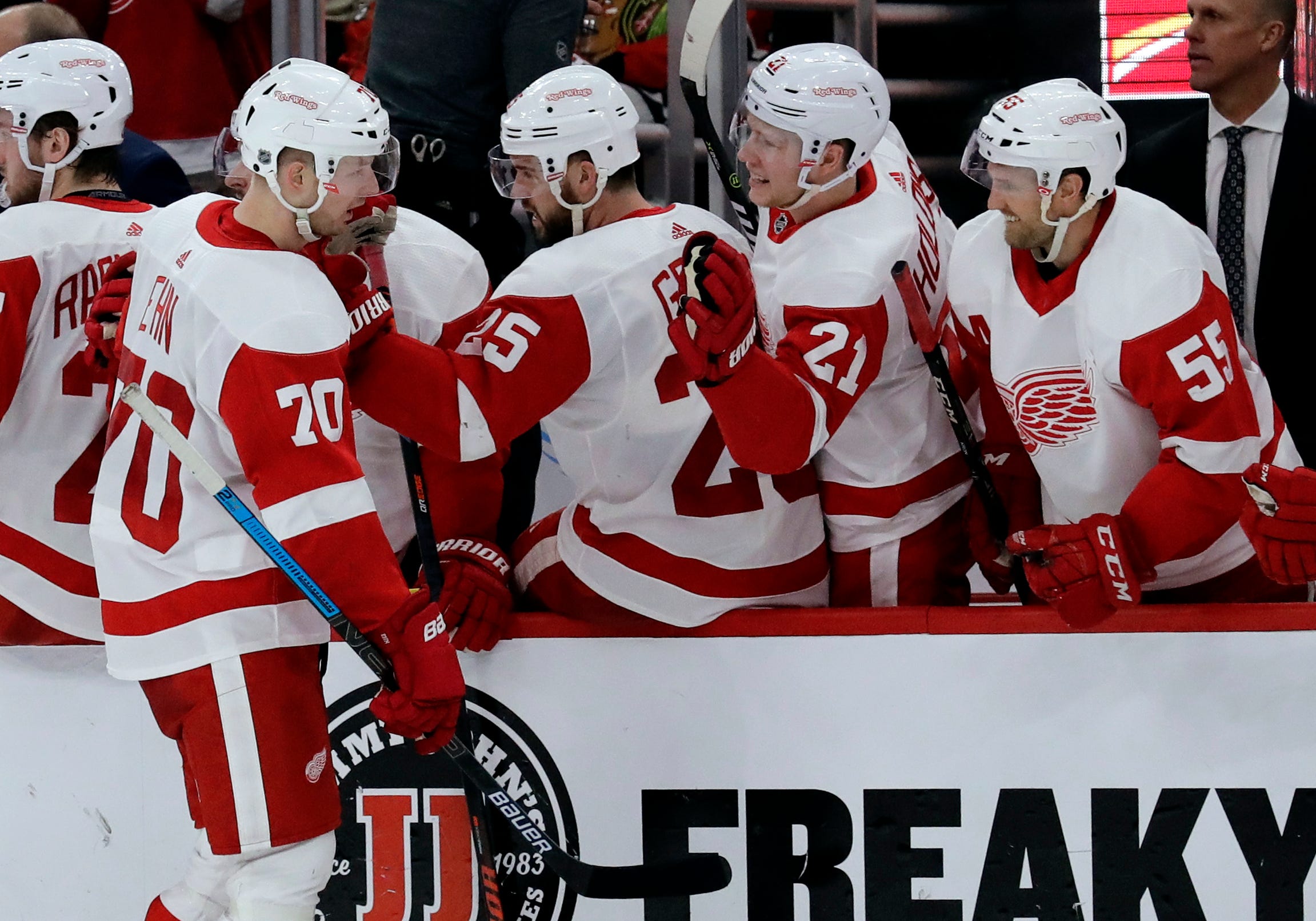 Detroit Red Wings center Christoffer Ehn (70) celebrates with teammates after scoring a goal against the Chicago Blackhawks during the second period.