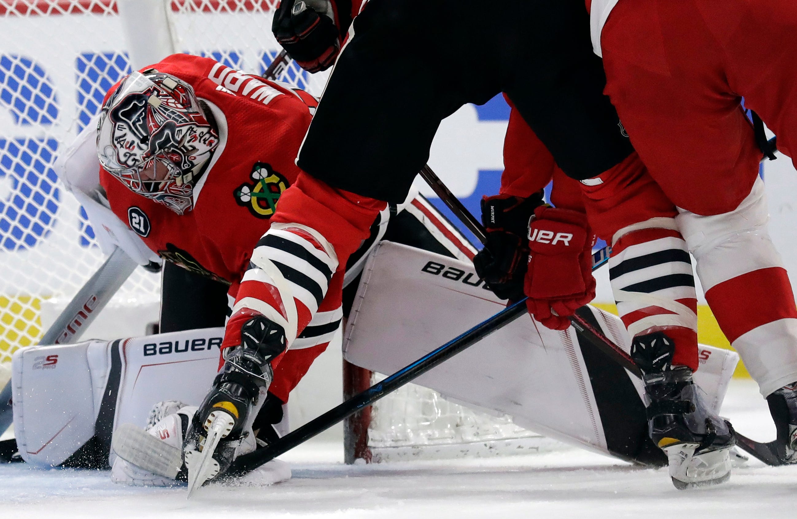 Chicago Blackhawks goalie Cam Ward stops a shot during the first period.