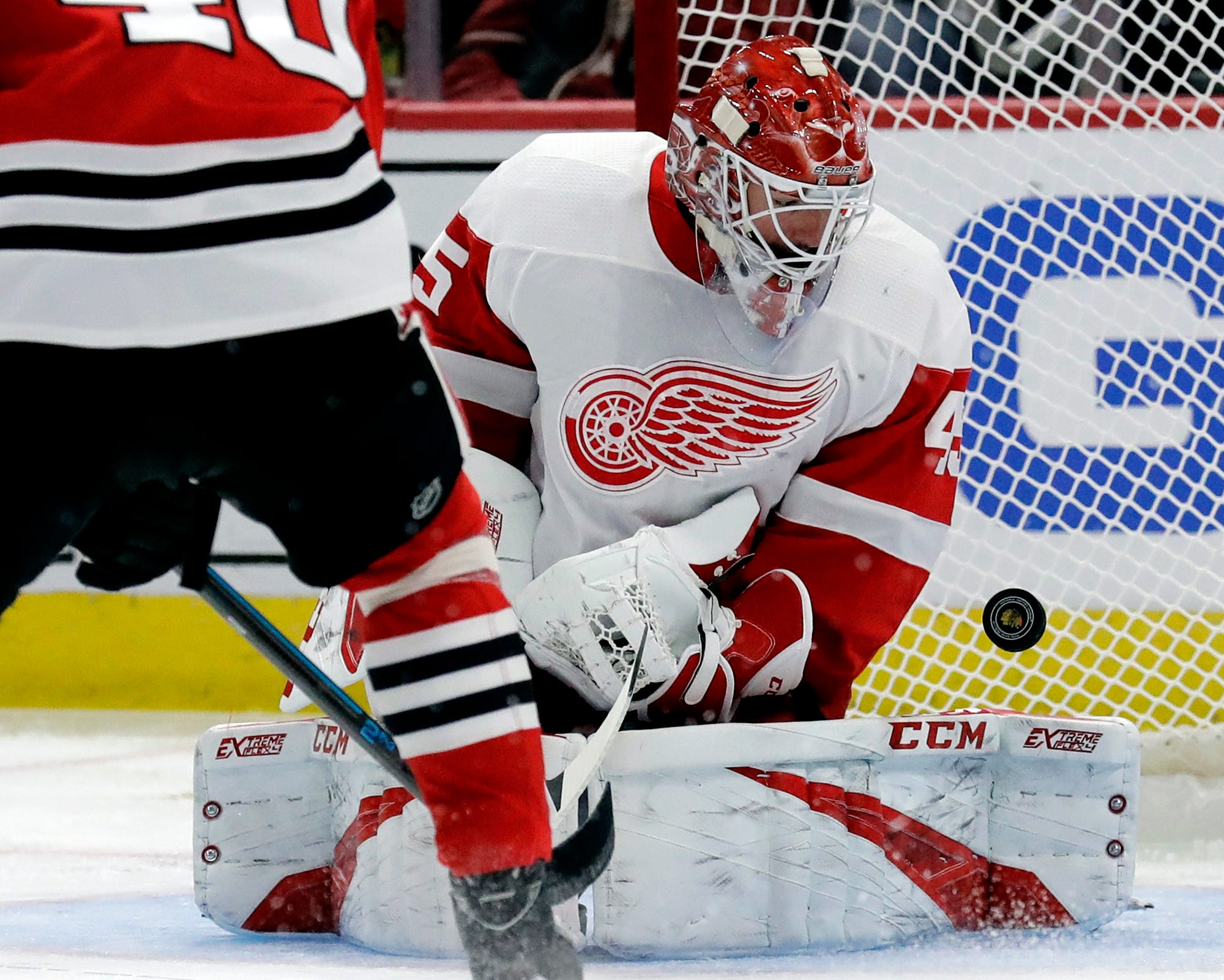 Detroit Red Wings goalie Jonathan Bernier blocks a shot against the Chicago Blackhawks during the second period of an NHL hockey game Sunday, Feb. 10, 2019, in Chicago.  Detroit lost to Chicago 5-2