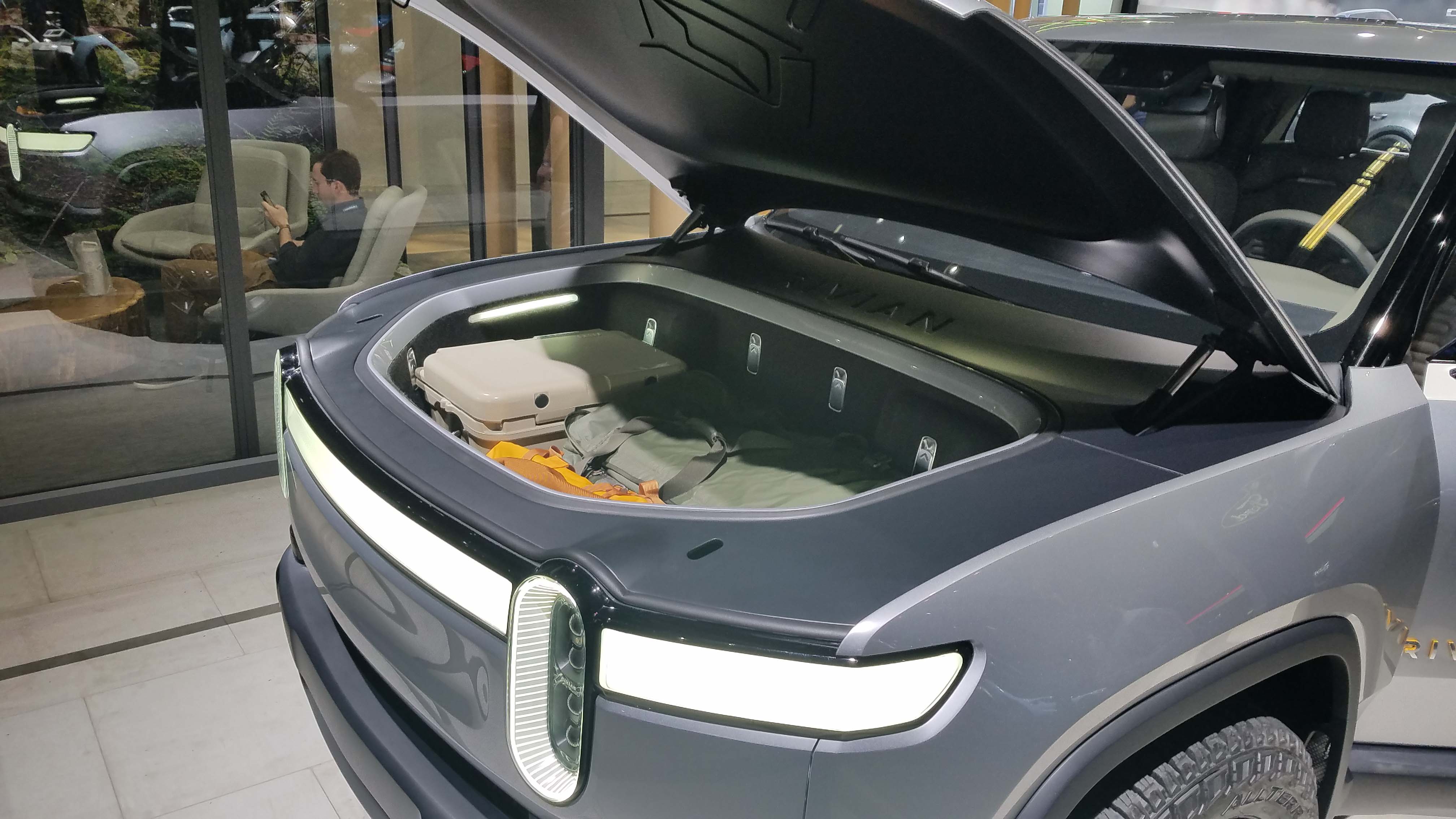 With its battery in the floor like a Tesla Model X SUV, the Rivian R1T boasts 12 cubic feet of storage space up front where a pickup's engine would normally be found.