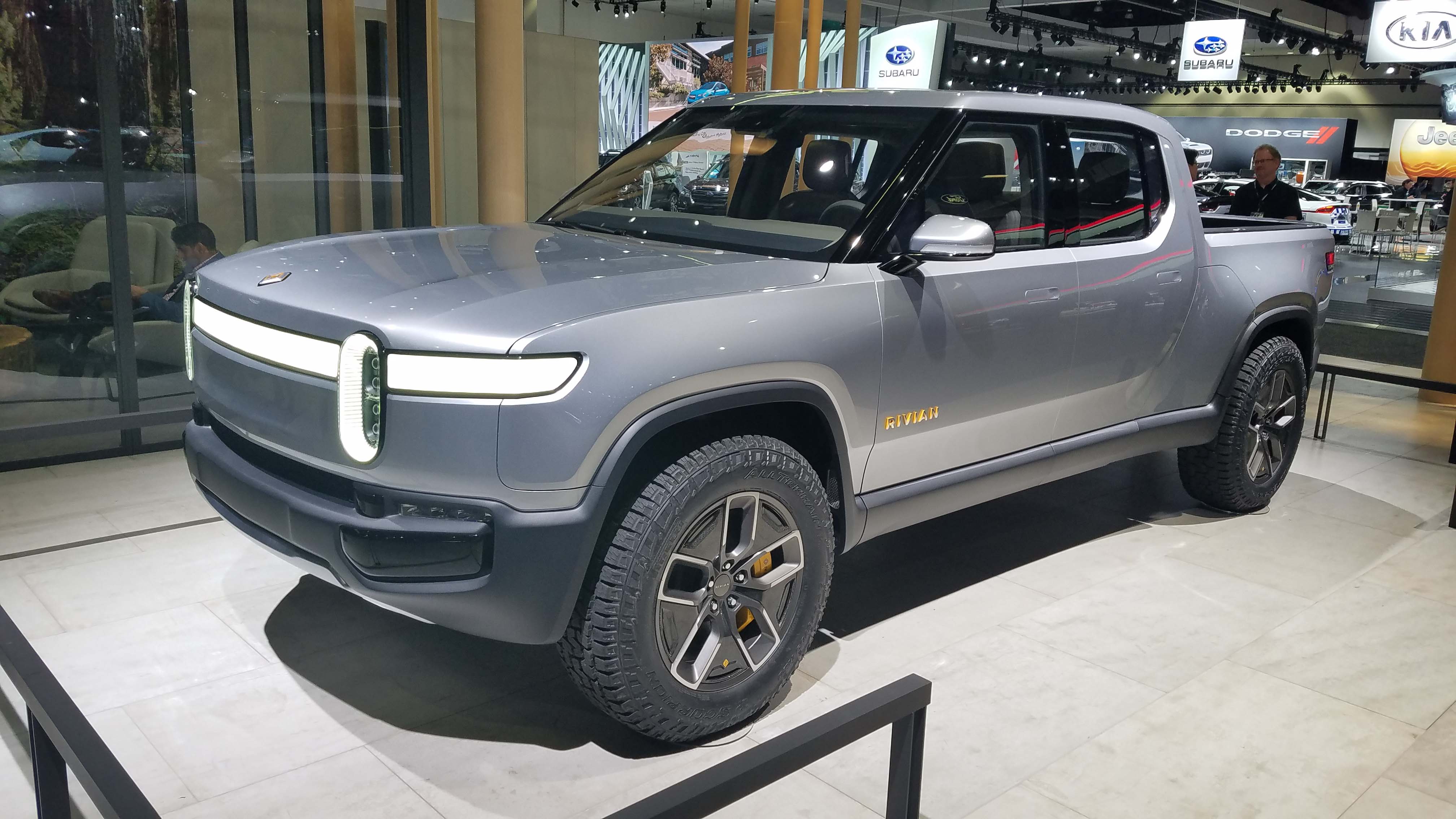 Electric truckmaker Rivian introduced the R1T pickup EV at the Los Angeles auto show last November. GM and Amazon are reportedly negotiating an investment stake in the automaker.