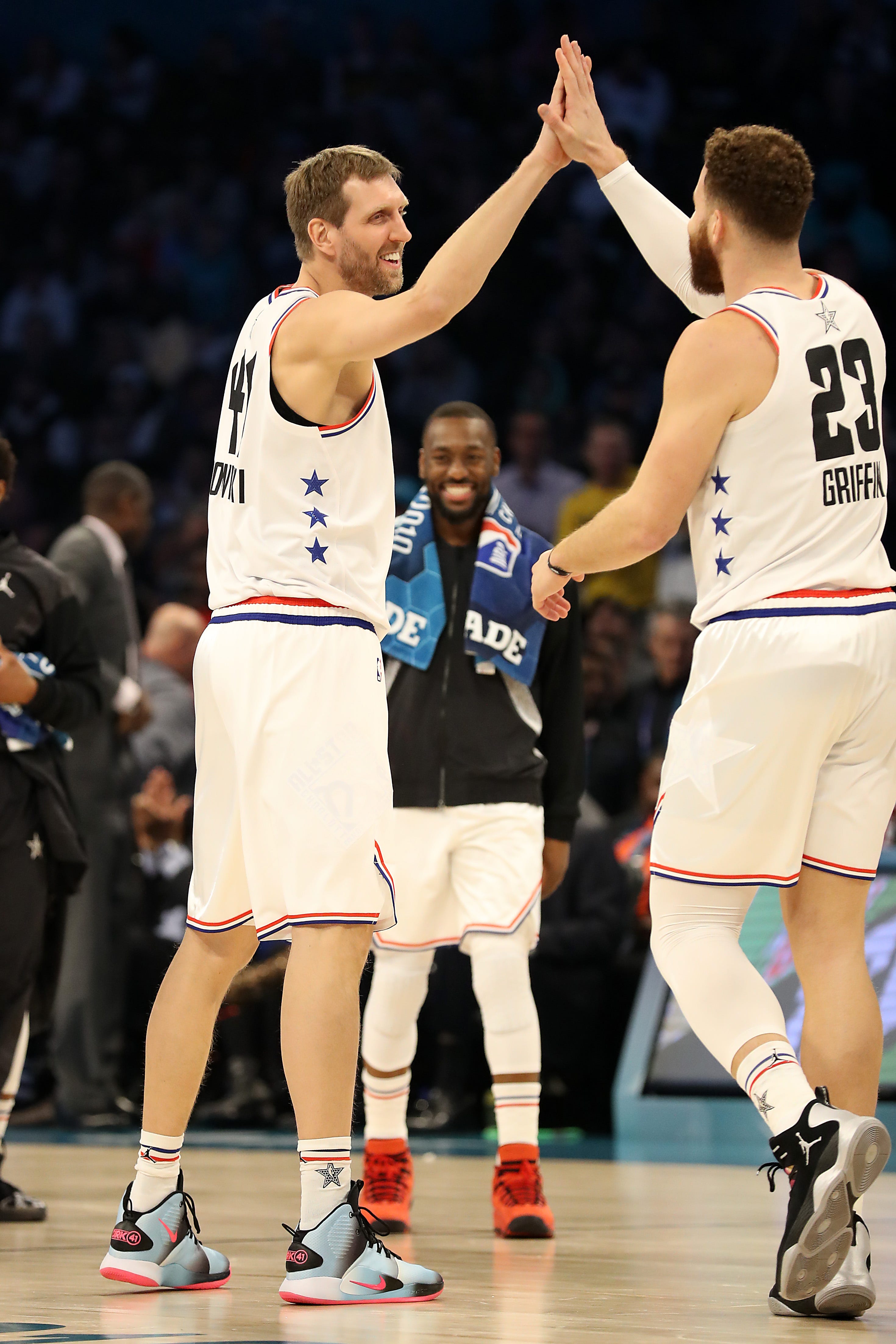 Dirk Nowitzki of the Dallas Mavericks and Team Giannis reacts with Blake Griffin of the Pistons against Team LeBron in the second quarter.