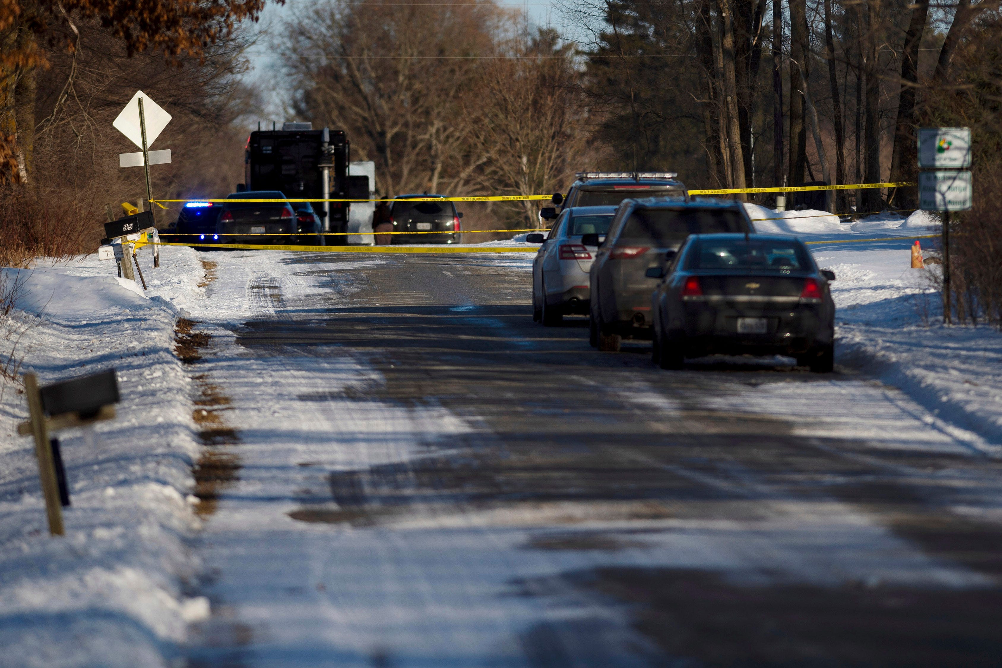 Kent County Sheriff personnel investigate the scene of a fatal shooting on Monday, Feb. 18, 2019, near Cedar Springs, Michigan.