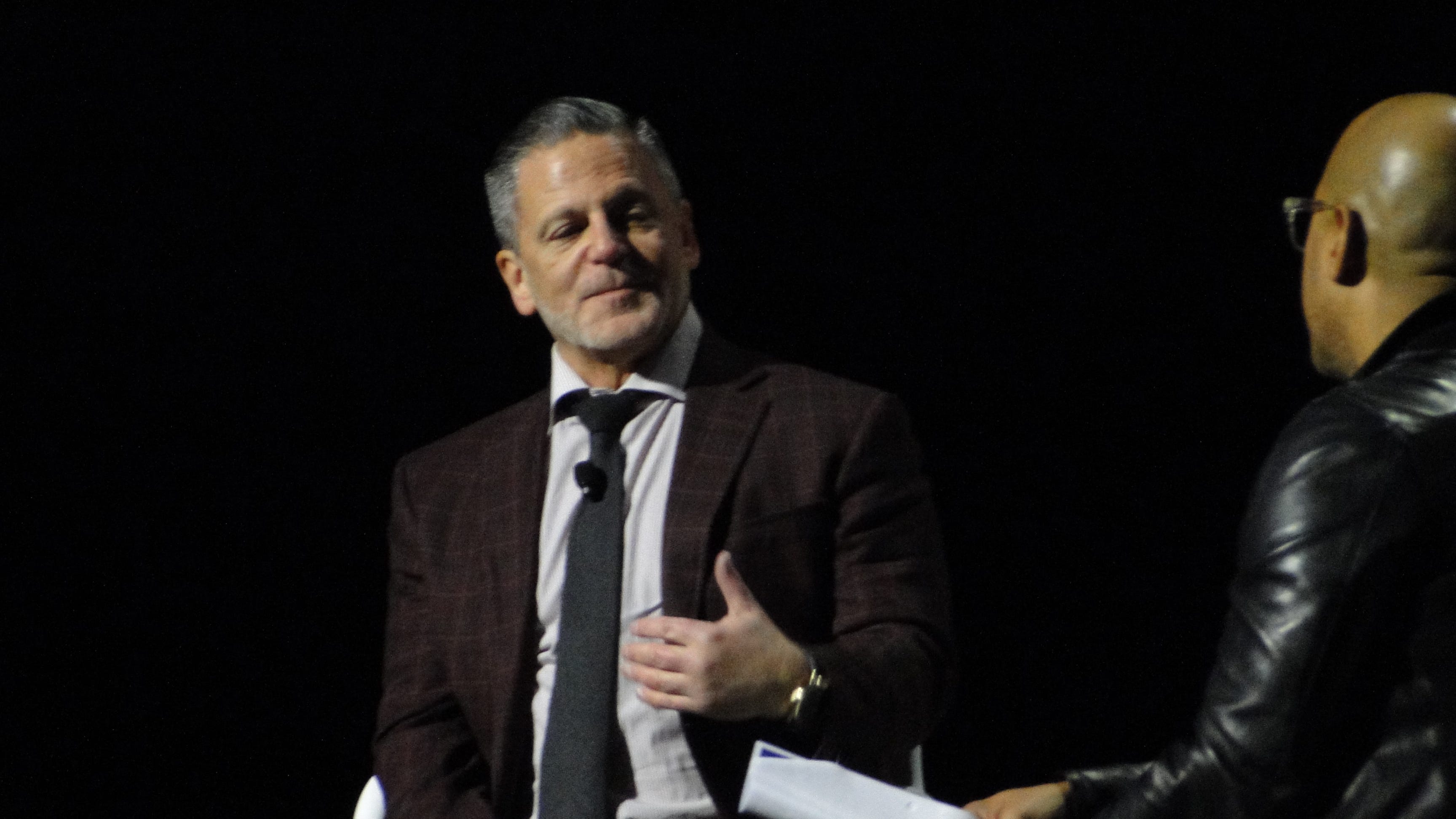 Quicken Loans founder and chairman Dan Gilbert speaks with Dennis Archer Jr., CEO of Ignition Media Group, at the Detroit Regional Chamber's Detroit Policy Conference.